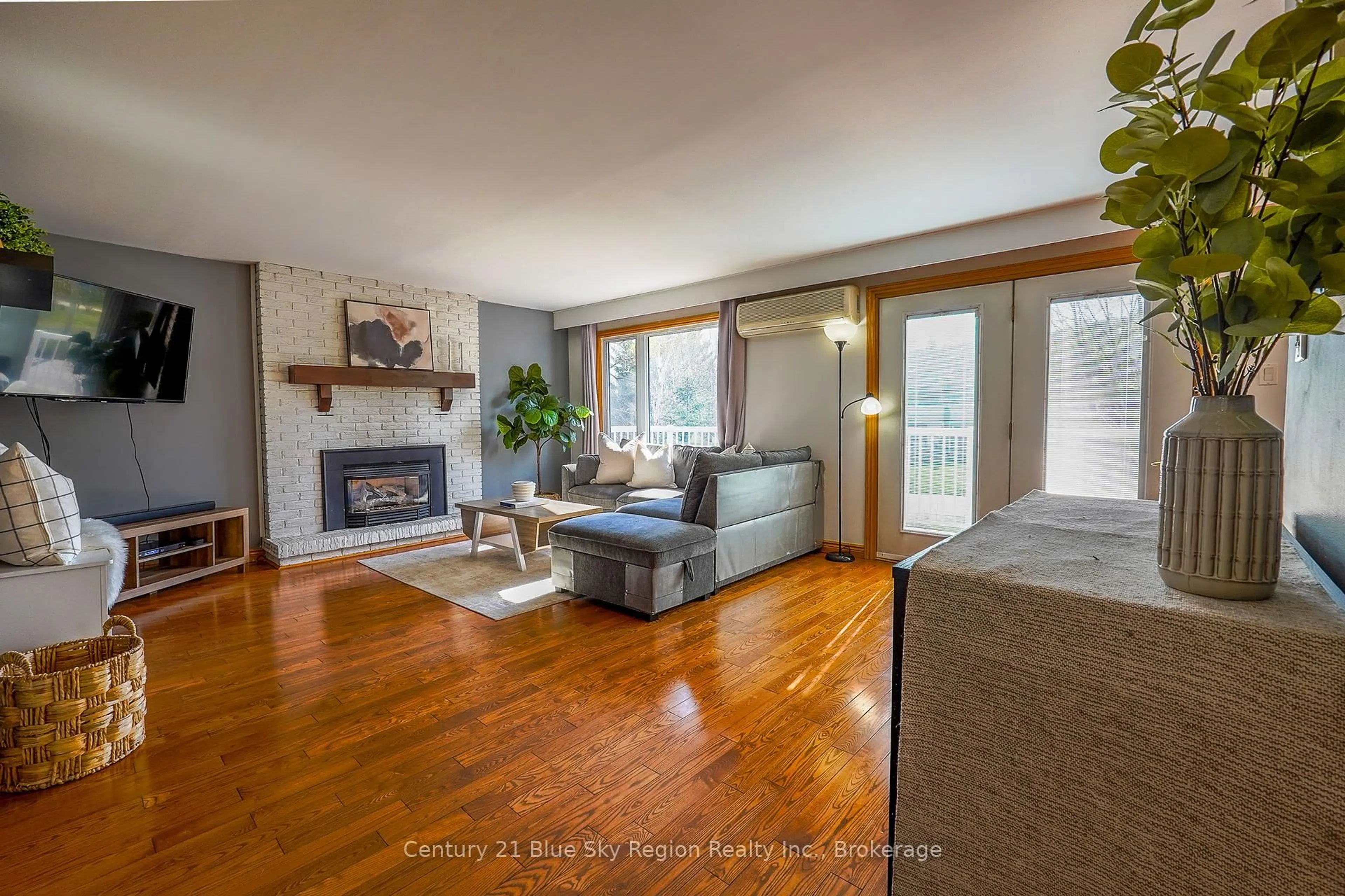Living room with furniture, wood/laminate floor for 240 Lees Rd, North Bay Ontario P1C 0B2