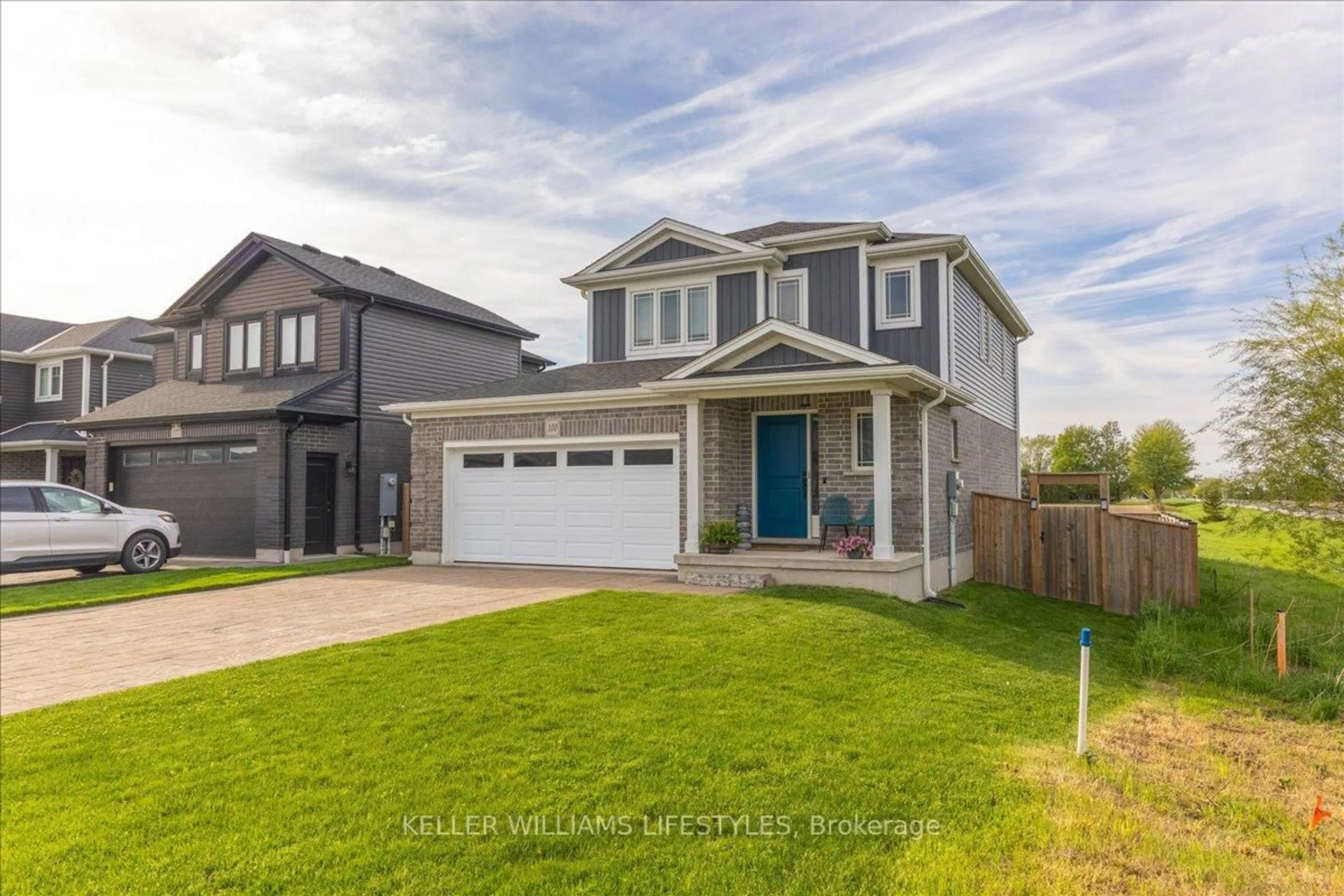 Home with vinyl exterior material, street for 100 GILMOUR Dr, Lucan Biddulph Ontario N0M 2J0