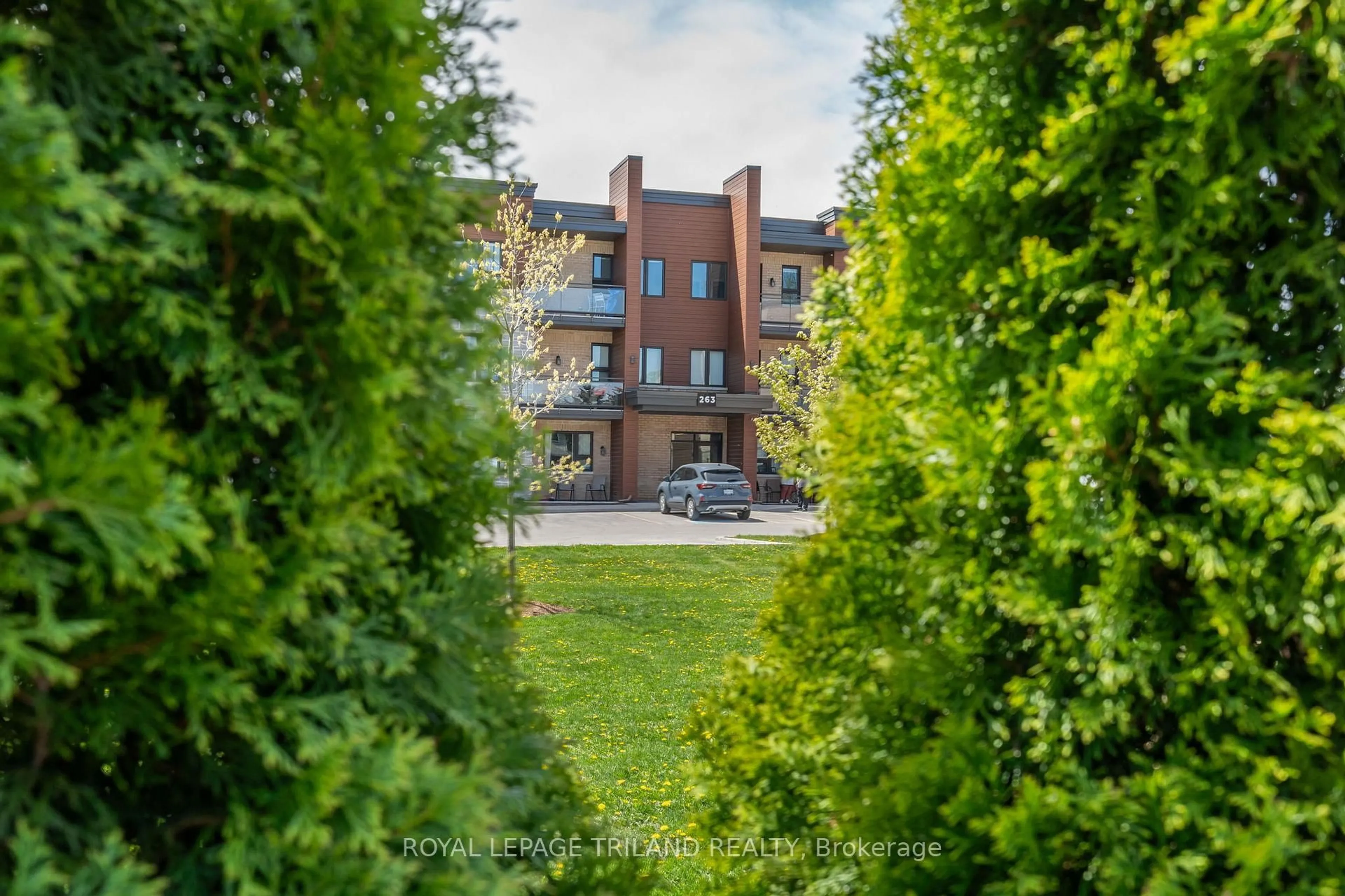 A pic from outside/outdoor area/front of a property/back of a property/a pic from drone, unknown for 263 Butler St #305, Lucan Biddulph Ontario N0M 2J0