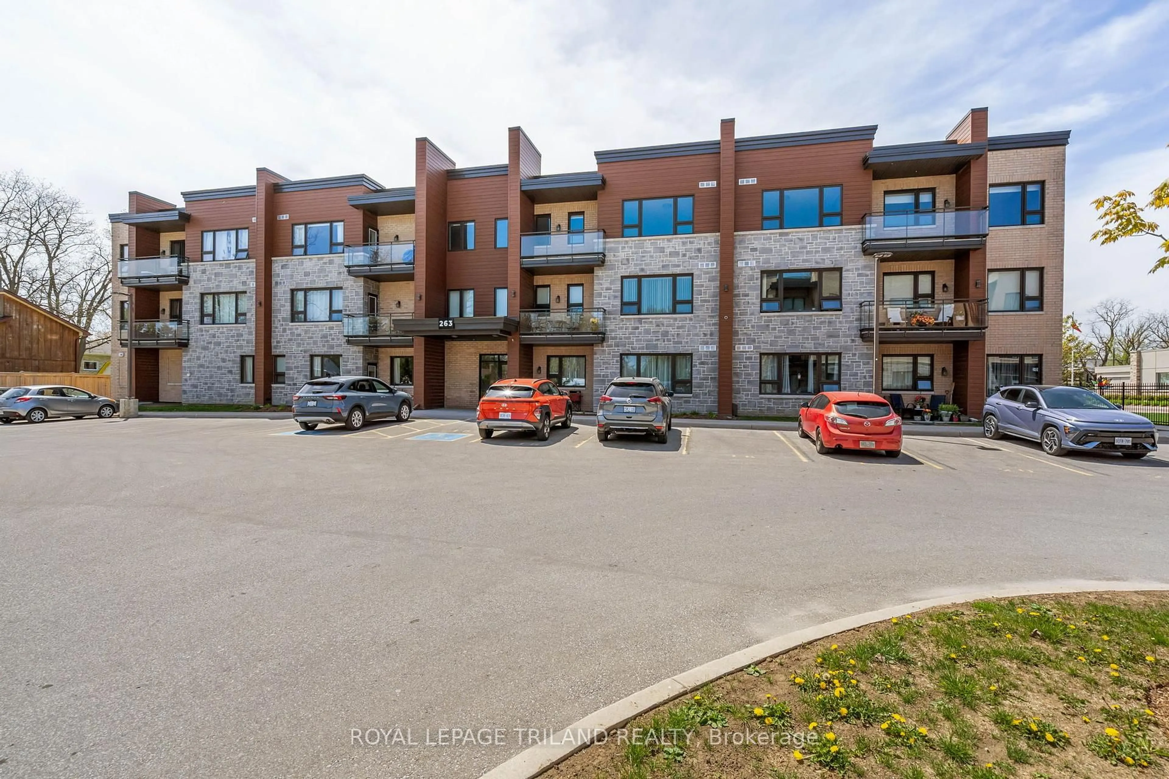 A pic from outside/outdoor area/front of a property/back of a property/a pic from drone, unknown for 263 Butler St #305, Lucan Biddulph Ontario N0M 2J0
