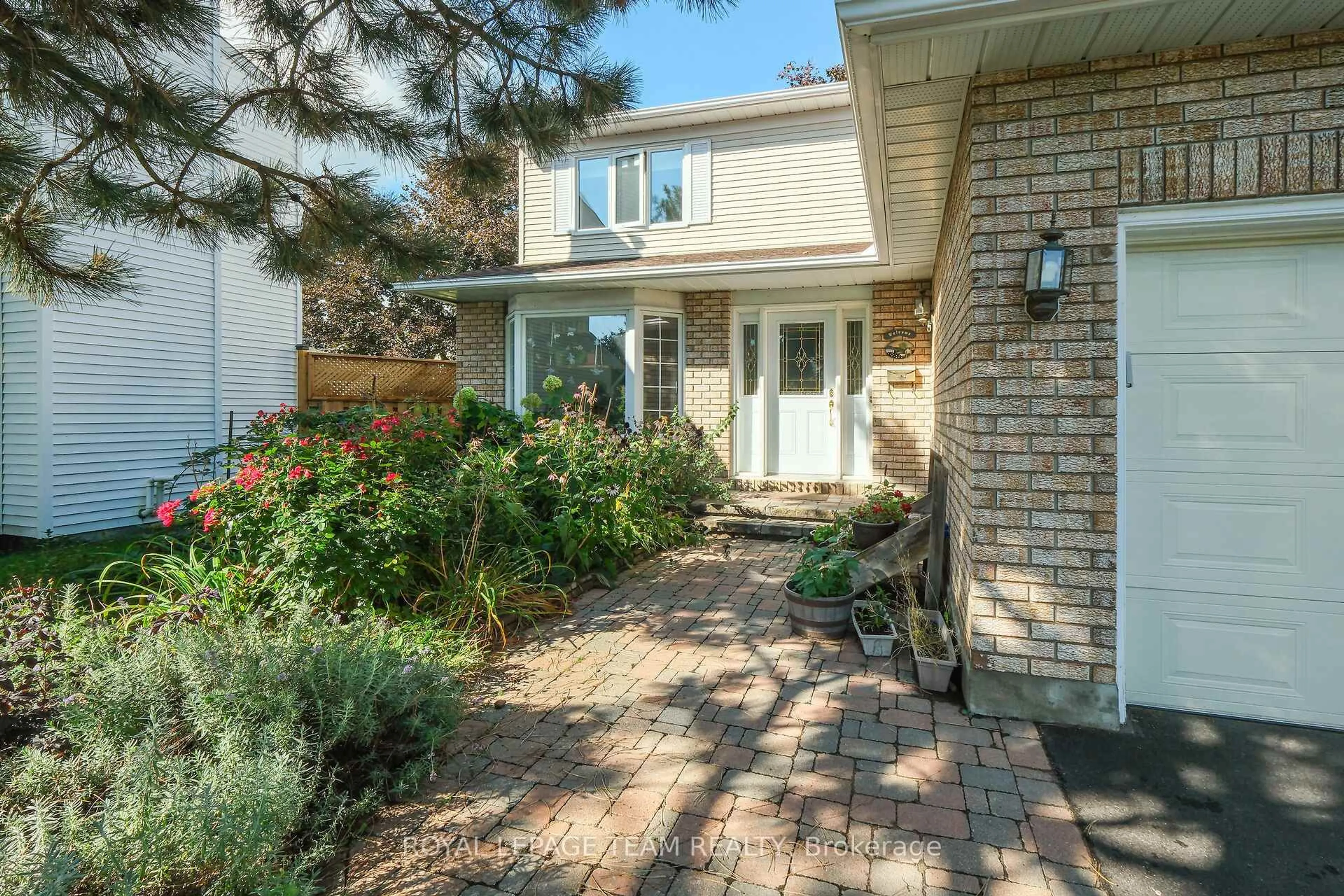Home with brick exterior material, street for 1204 New Yorker Crt, Ottawa Ontario K1T 2S2