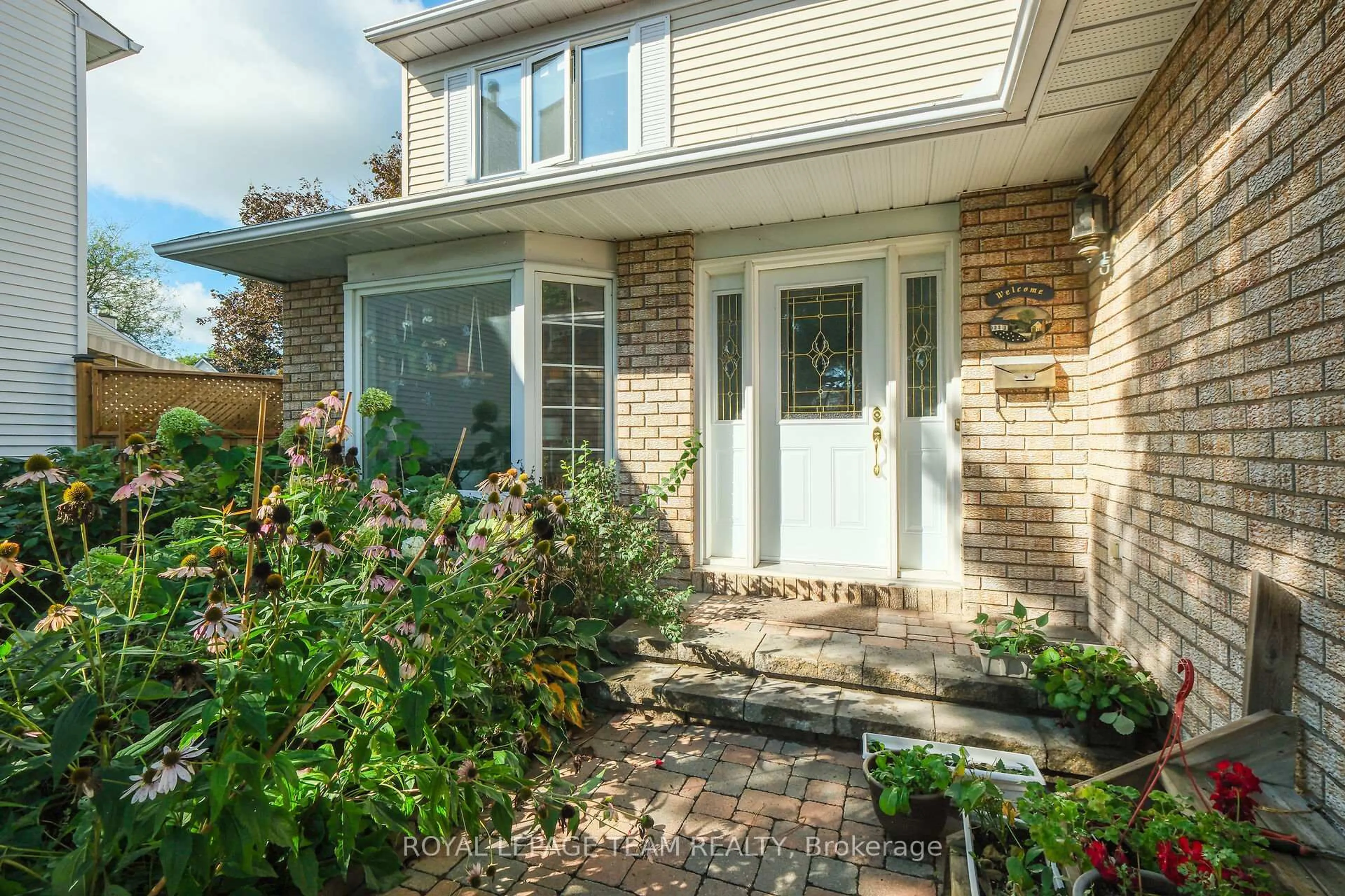 Home with brick exterior material, street for 1204 New Yorker Crt, Ottawa Ontario K1T 2S2