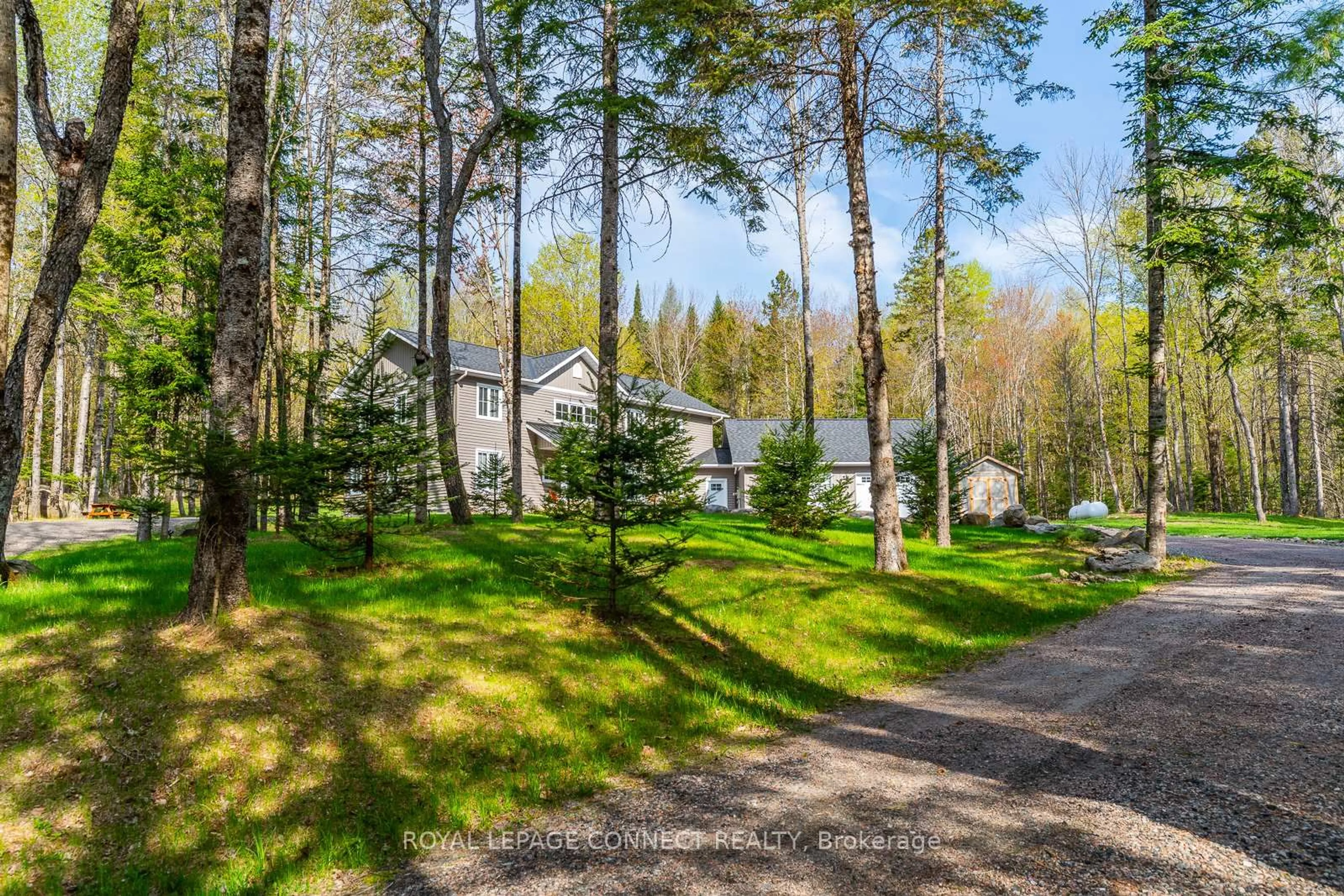 A pic from outside/outdoor area/front of a property/back of a property/a pic from drone, forest/trees view for 63 Bayshore Rd, Dysart et al Ontario K0M 1S0