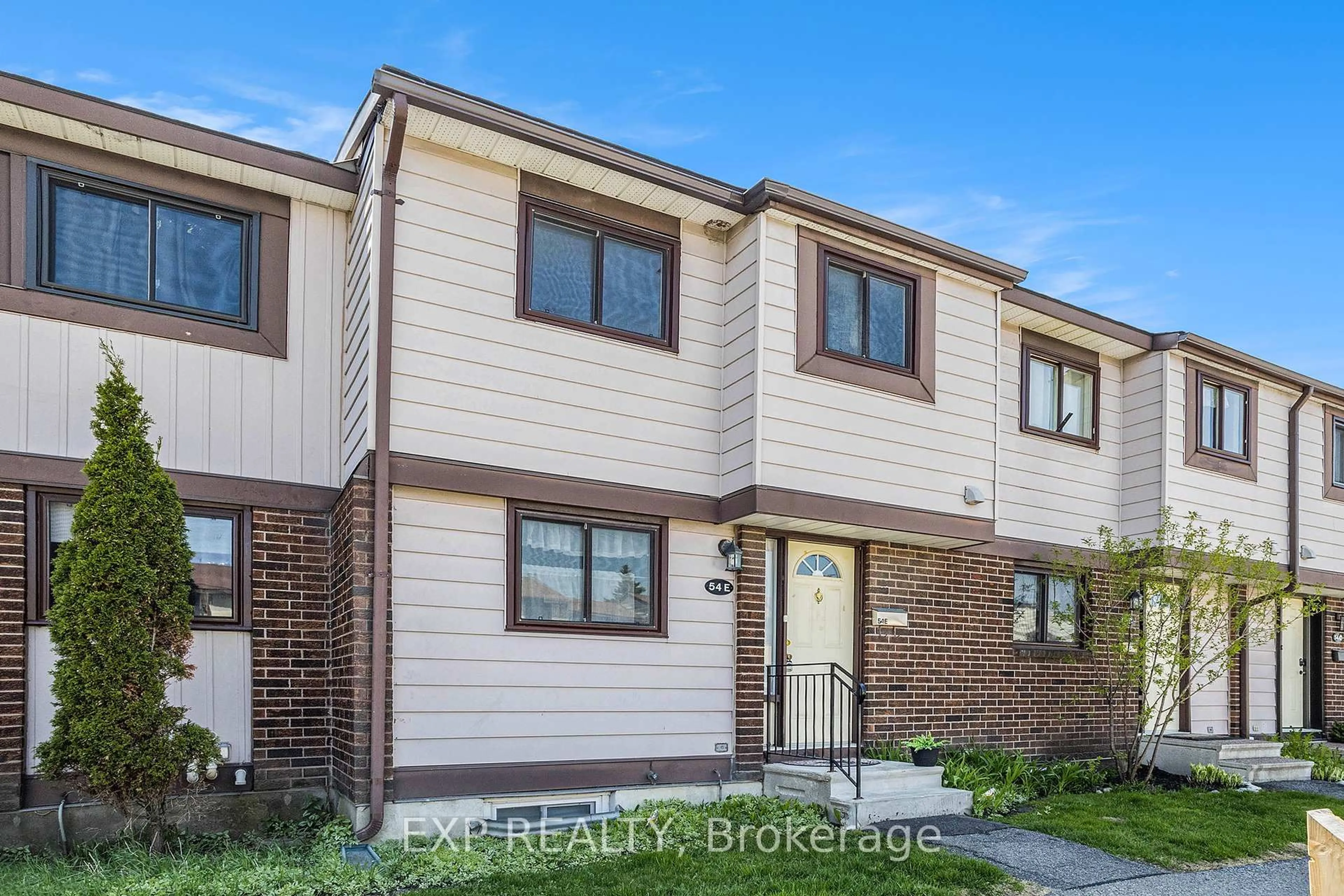 Home with brick exterior material, street for 54 Foxfield Dr #E, Ottawa Ontario K2J 1P7