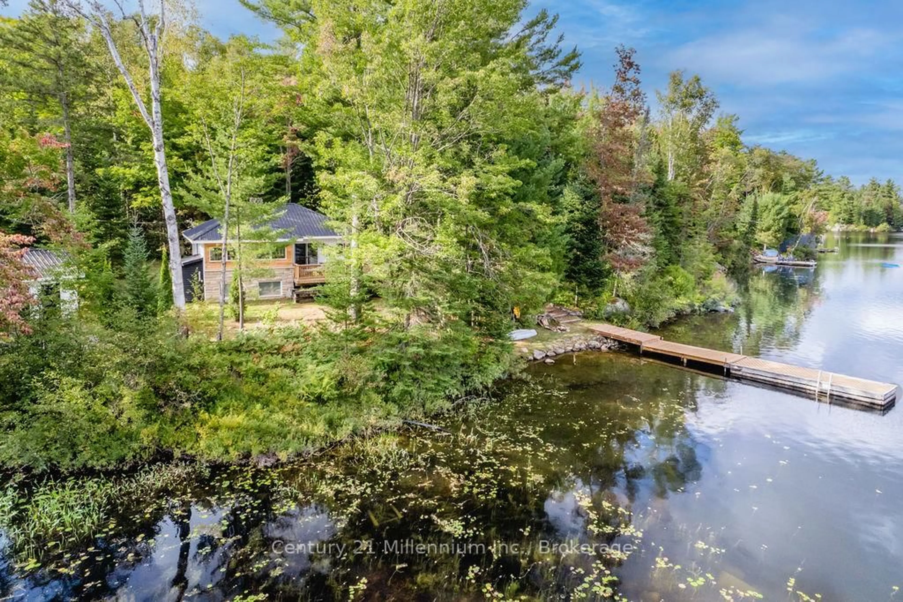 A pic from outside/outdoor area/front of a property/back of a property/a pic from drone, water/lake/river/ocean view for 1046 Pine Lake Shores Private, Bracebridge Ontario P0B 1A0