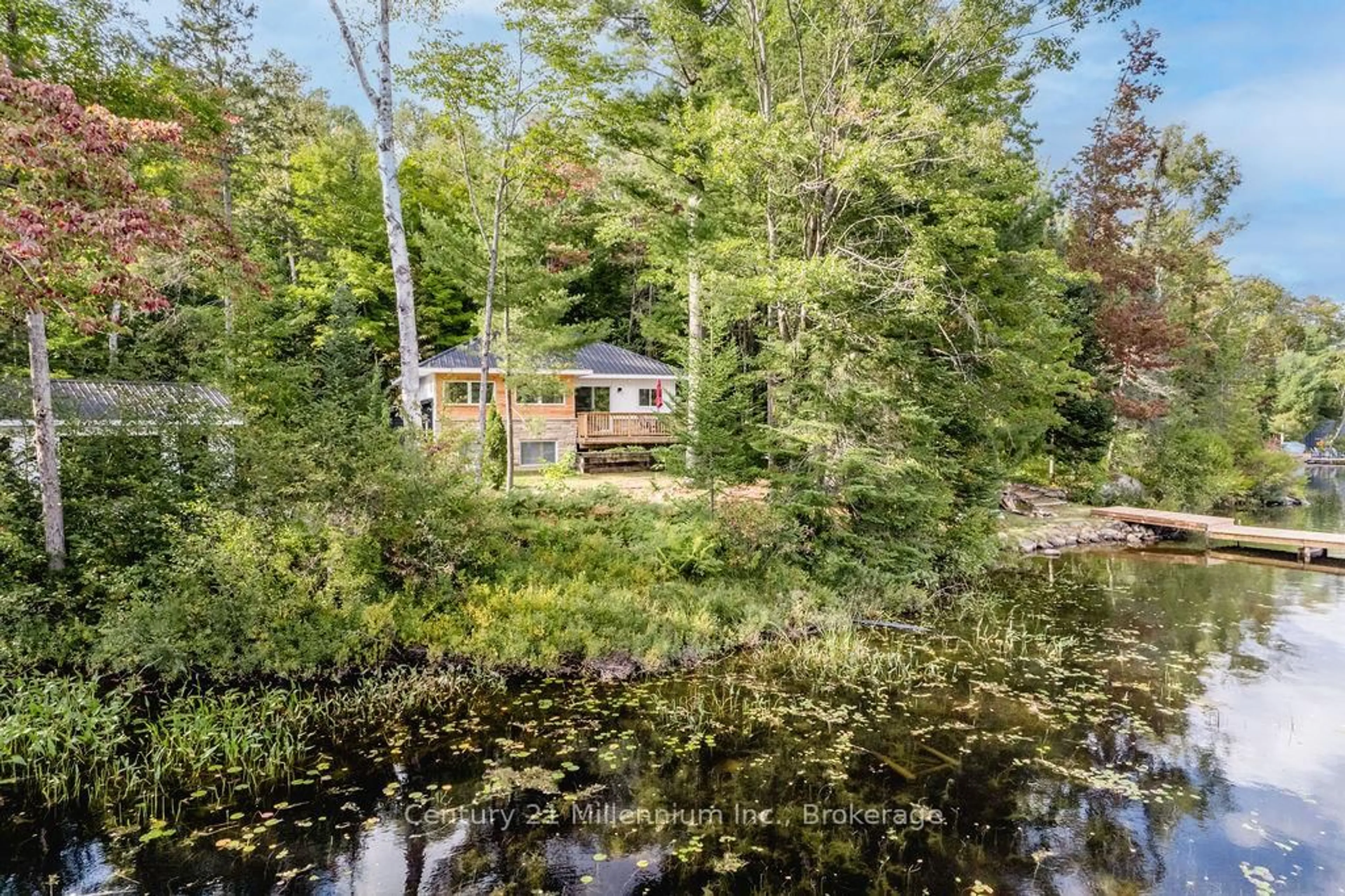 A pic from outside/outdoor area/front of a property/back of a property/a pic from drone, water/lake/river/ocean view for 1046 Pine Lake Shores Private, Bracebridge Ontario P0B 1A0