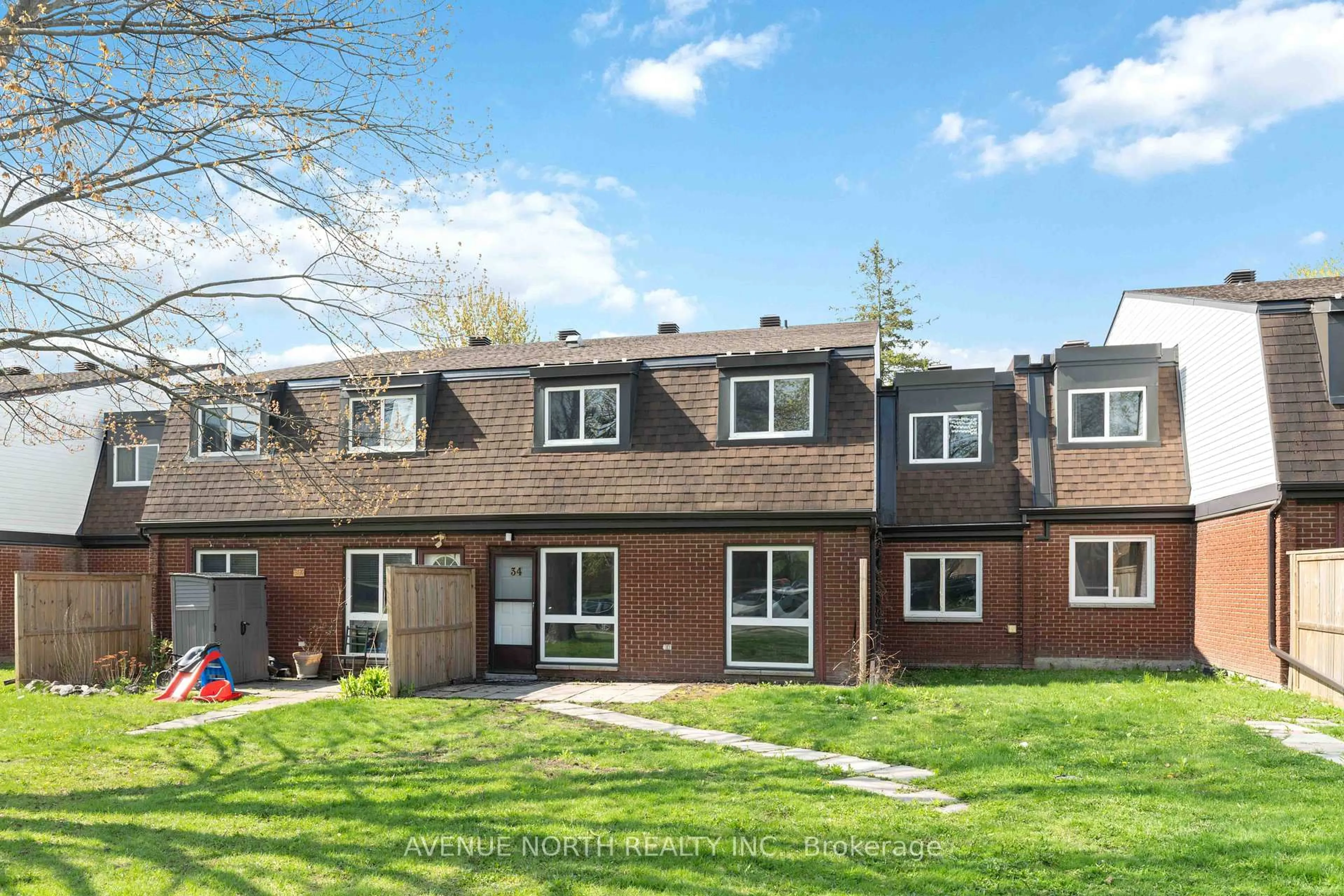 A pic from outside/outdoor area/front of a property/back of a property/a pic from drone, street for 1958 Jasmine Cres #34J, Ottawa Ontario K1J 7W1