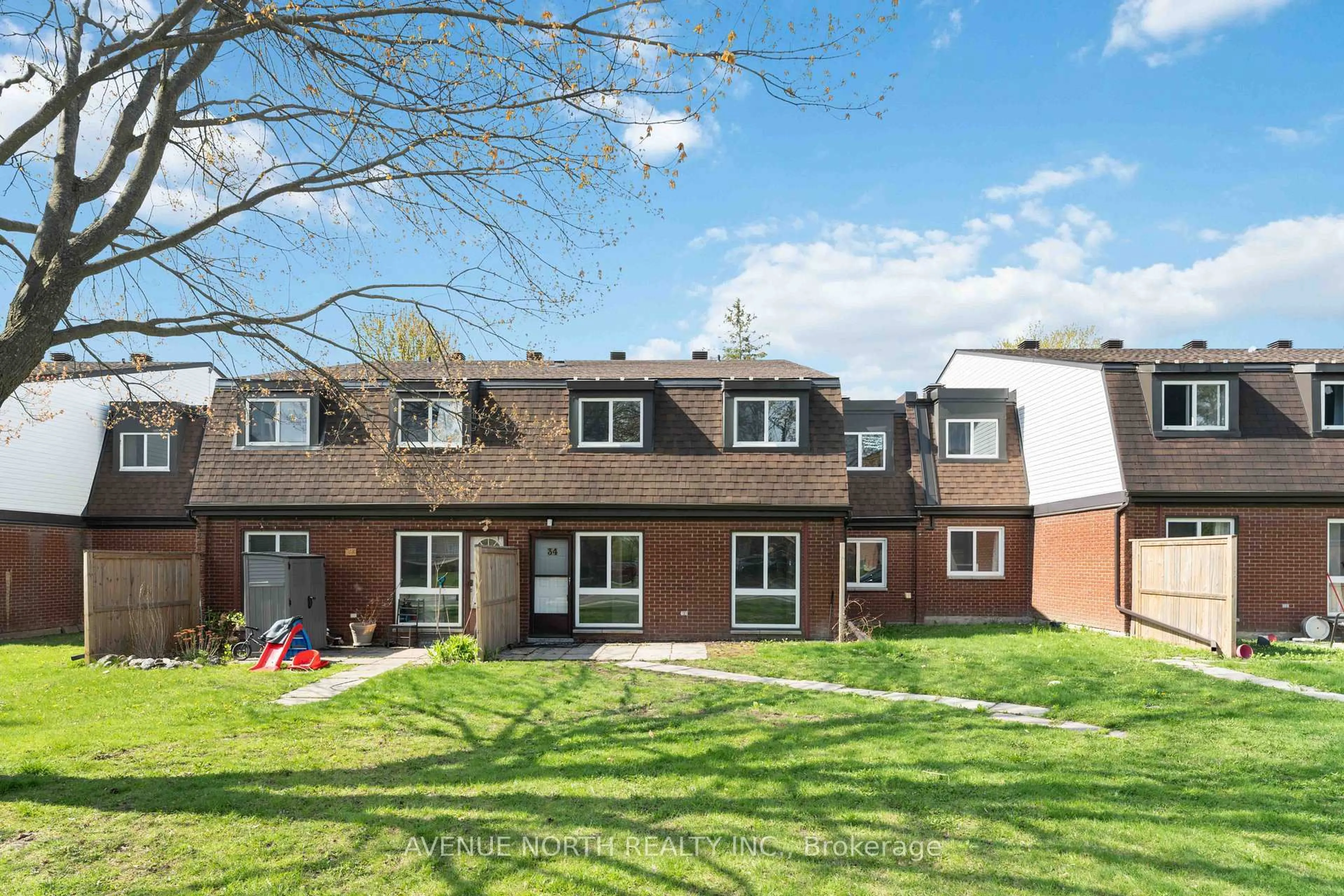 Home with brick exterior material, street for 1958 Jasmine Cres #34J, Ottawa Ontario K1J 7W1