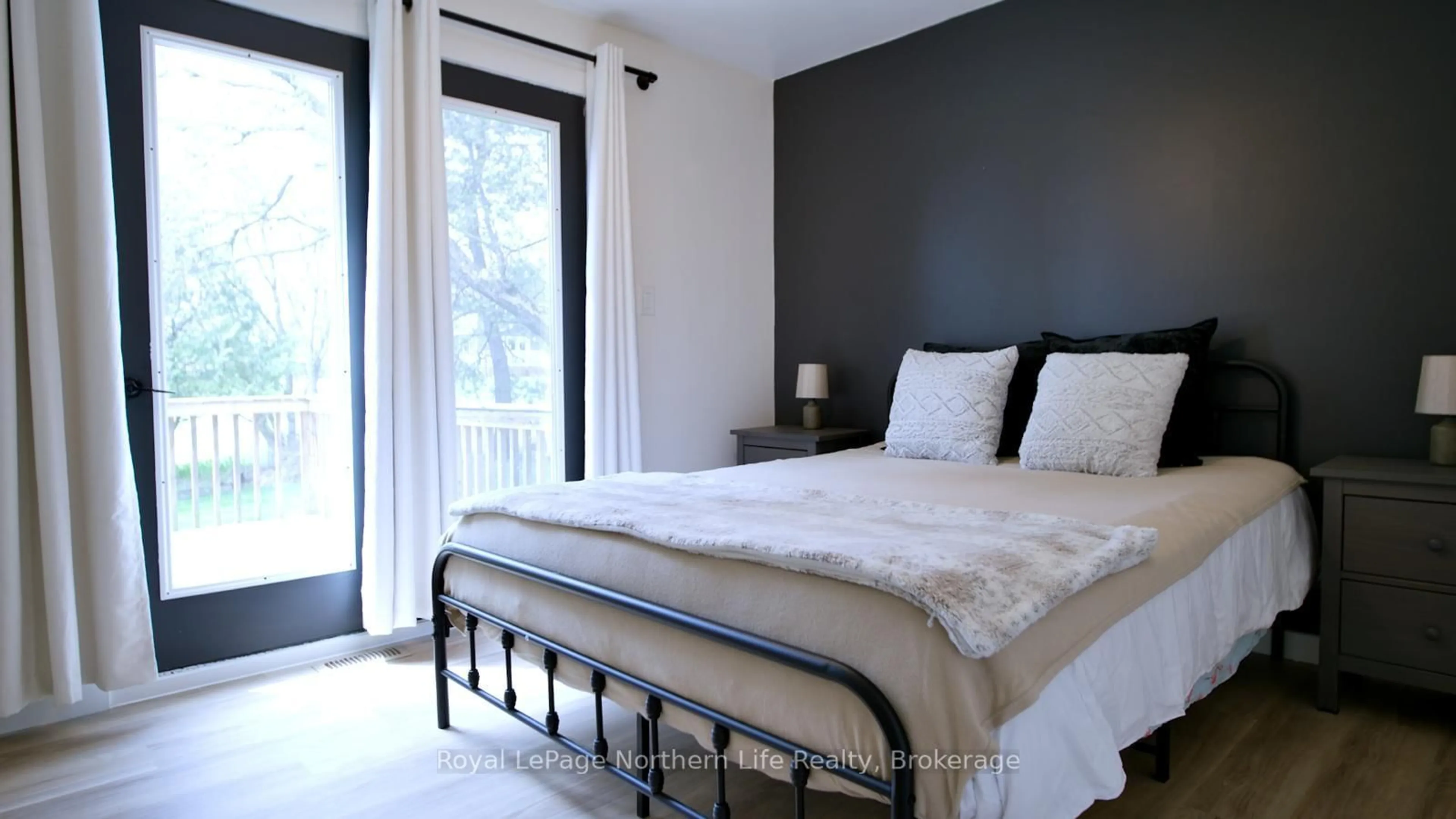 Bedroom with bed, wood/laminate floor for 321 Main St, Powassan Ontario P0H 1Z0