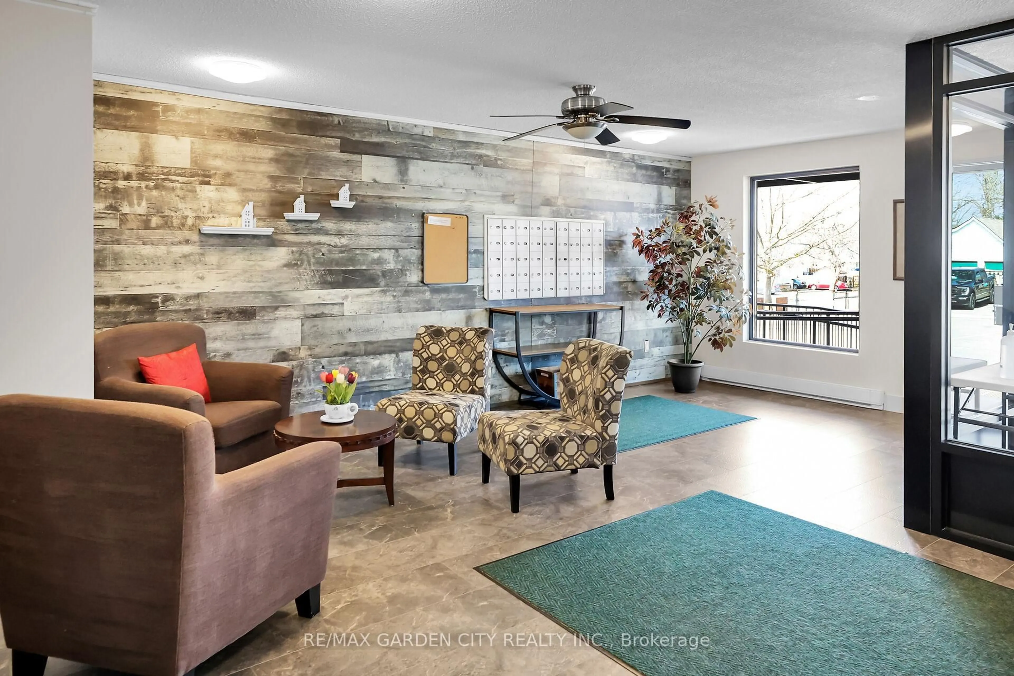 Living room with furniture, ceramic/tile floor for 4209 Hixon St #108, Lincoln Ontario L3J 0K2