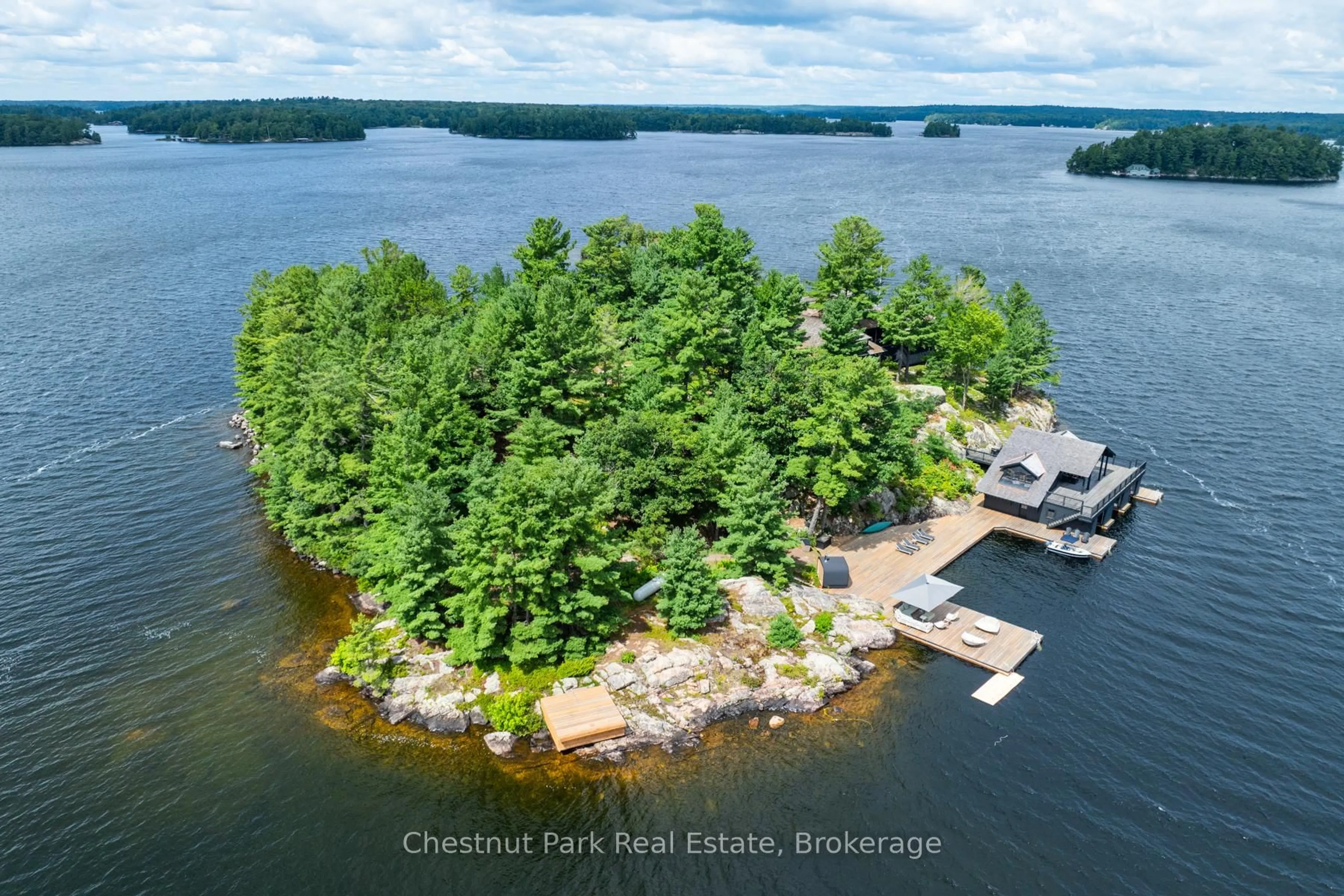 A pic from outside/outdoor area/front of a property/back of a property/a pic from drone, water/lake/river/ocean view for 1 Island R21 Island, Muskoka Lakes Ontario P0B 1J0
