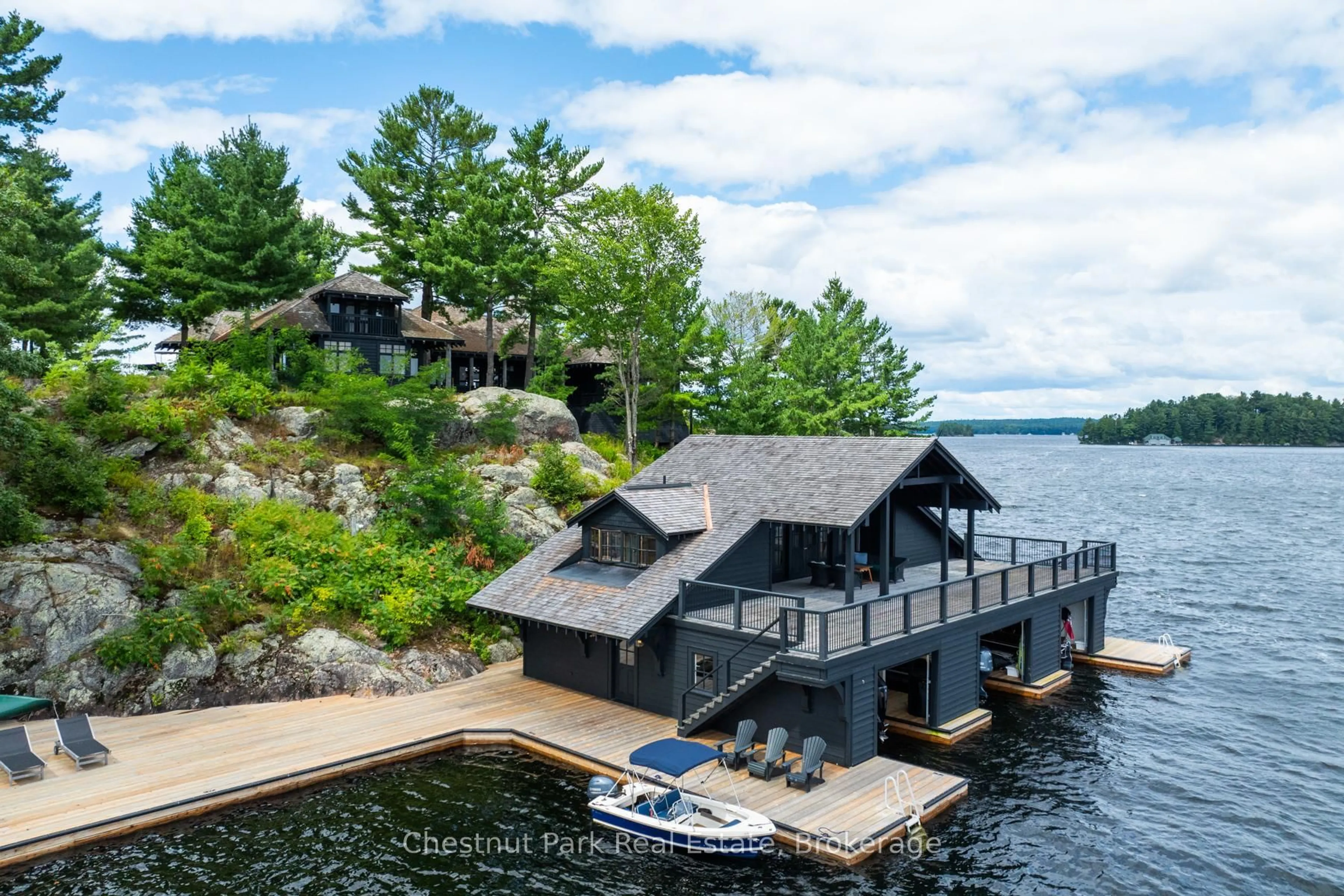 A pic from outside/outdoor area/front of a property/back of a property/a pic from drone, water/lake/river/ocean view for 1 Island R21 Island, Muskoka Lakes Ontario P0B 1J0