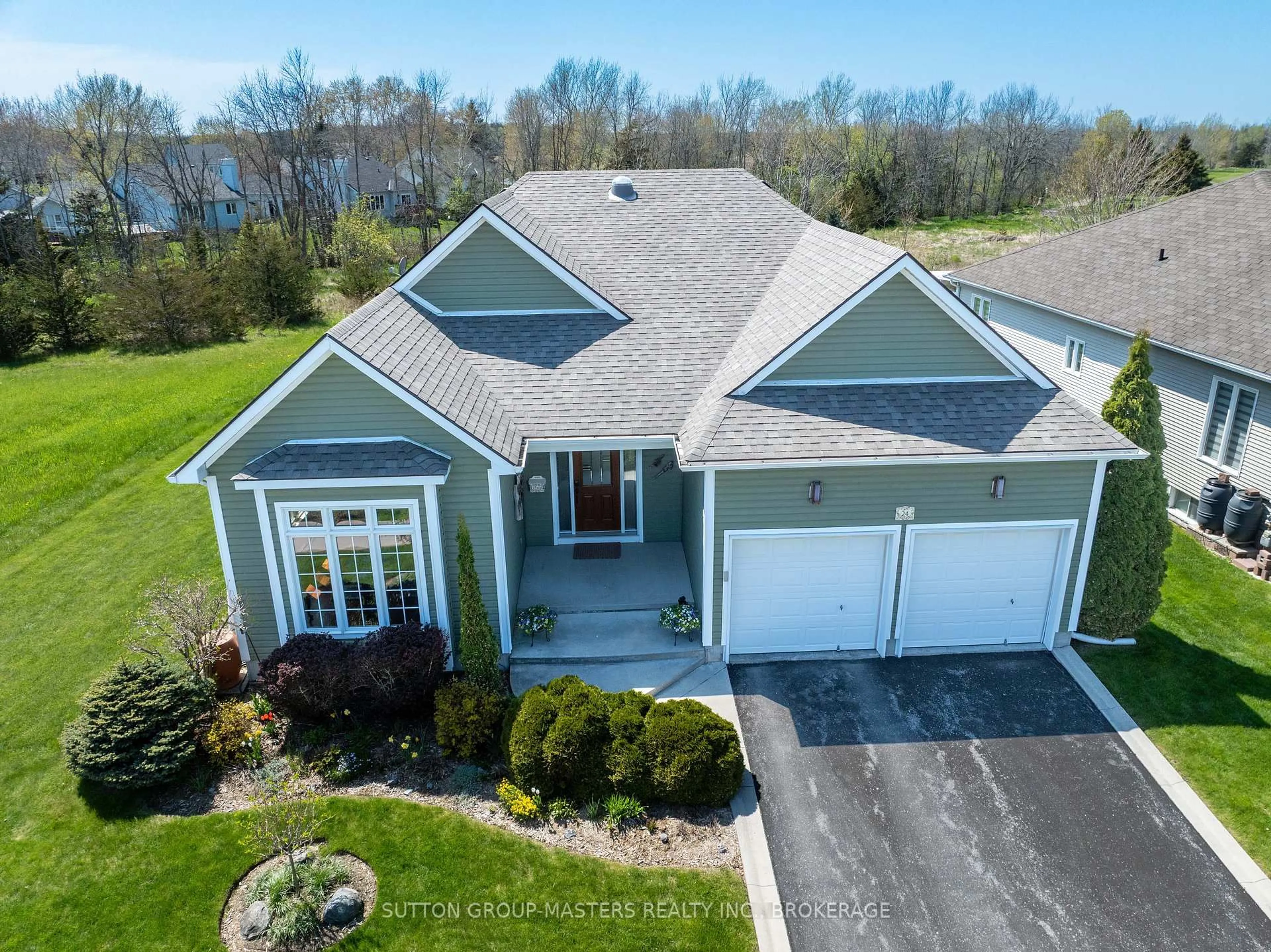 A pic from outside/outdoor area/front of a property/back of a property/a pic from drone, water/lake/river/ocean view for 24 Country Club Dr, Bath Ontario K0H 1G0