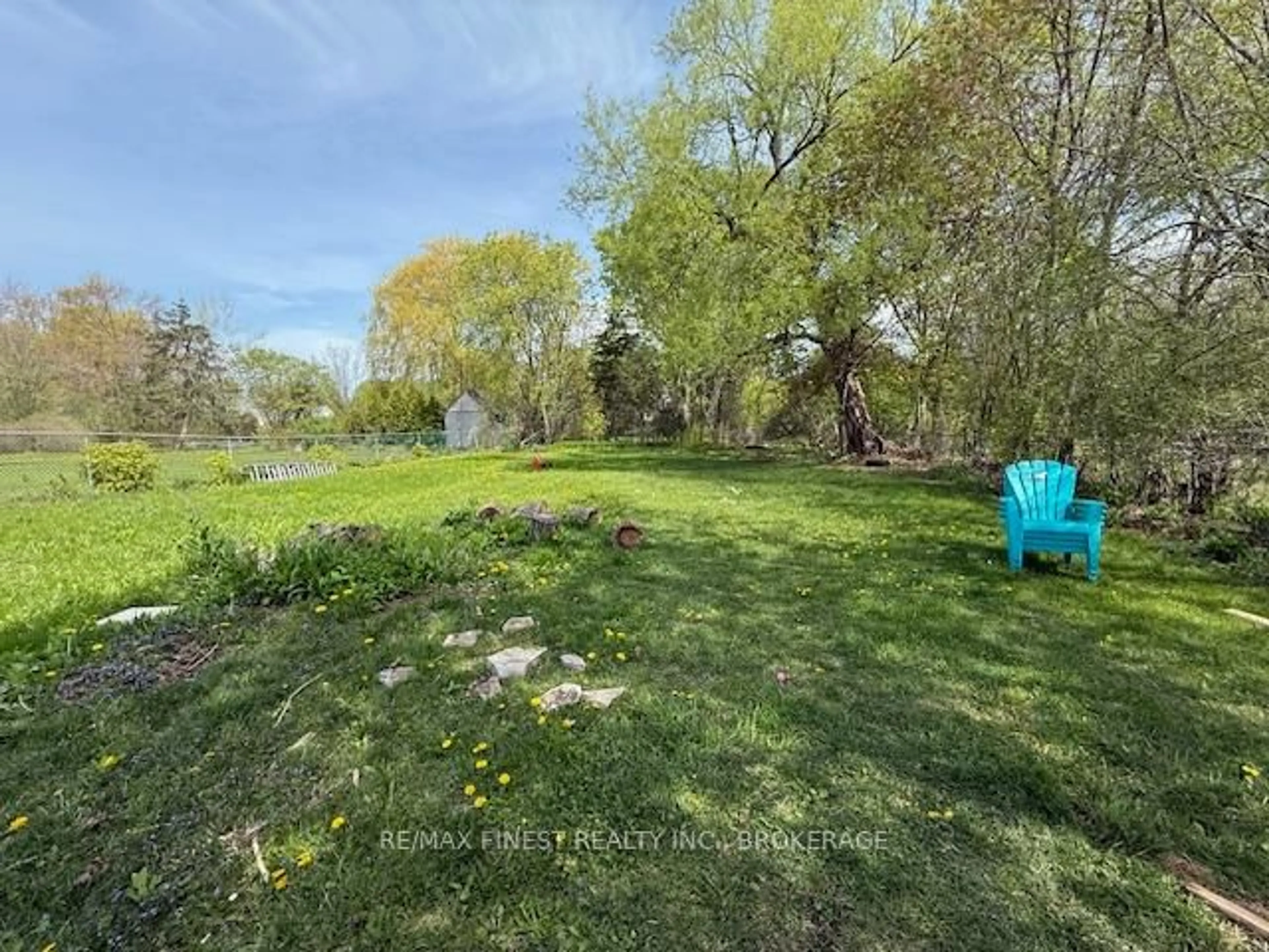 A pic from outside/outdoor area/front of a property/back of a property/a pic from drone, forest/trees view for 165 Phillips St, Kingston Ontario K7M 2Z9