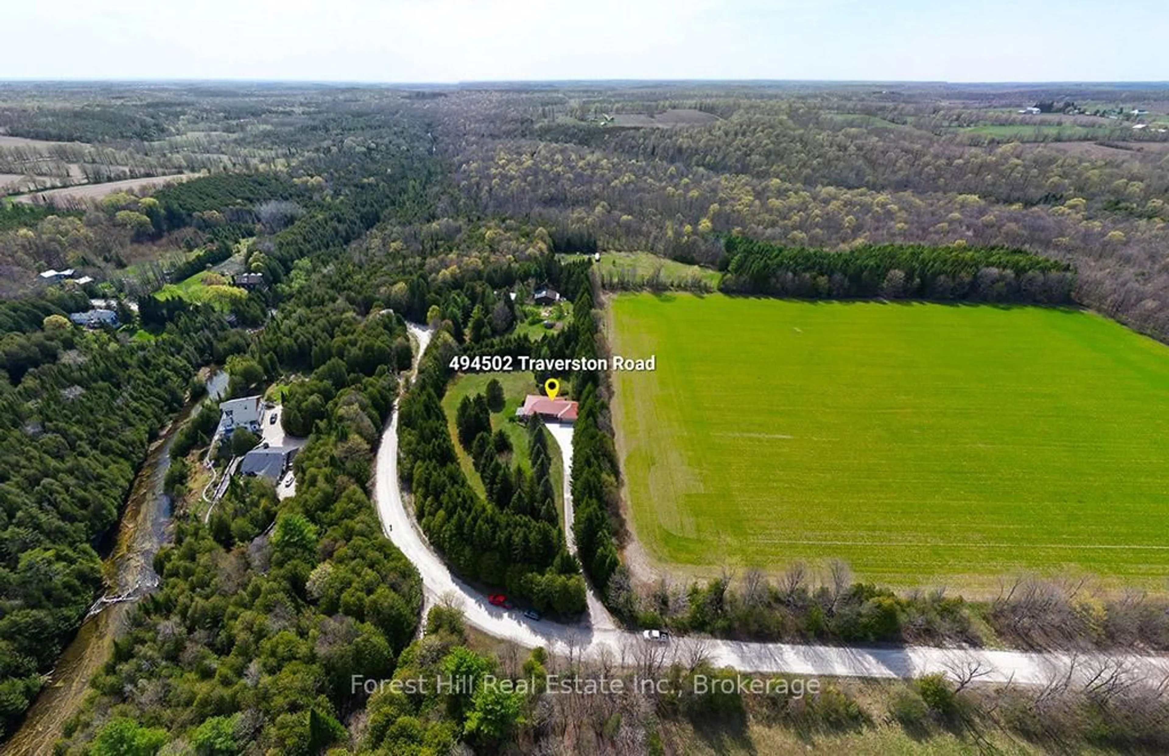 A pic from outside/outdoor area/front of a property/back of a property/a pic from drone, forest/trees view for 494502 Traverston Rd, West Grey Ontario N0C 1H0