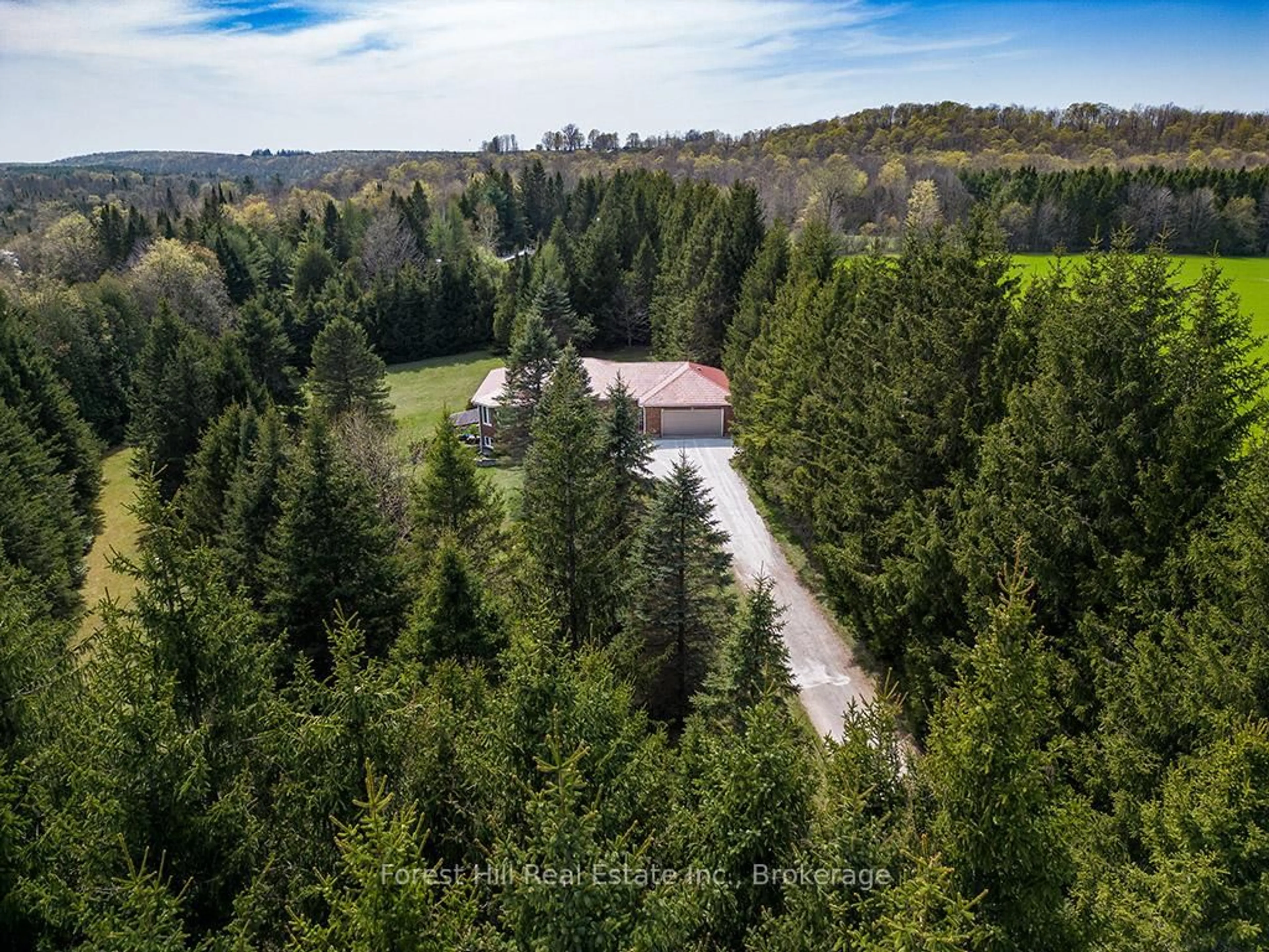 A pic from outside/outdoor area/front of a property/back of a property/a pic from drone, forest/trees view for 494502 Traverston Rd, West Grey Ontario N0C 1H0