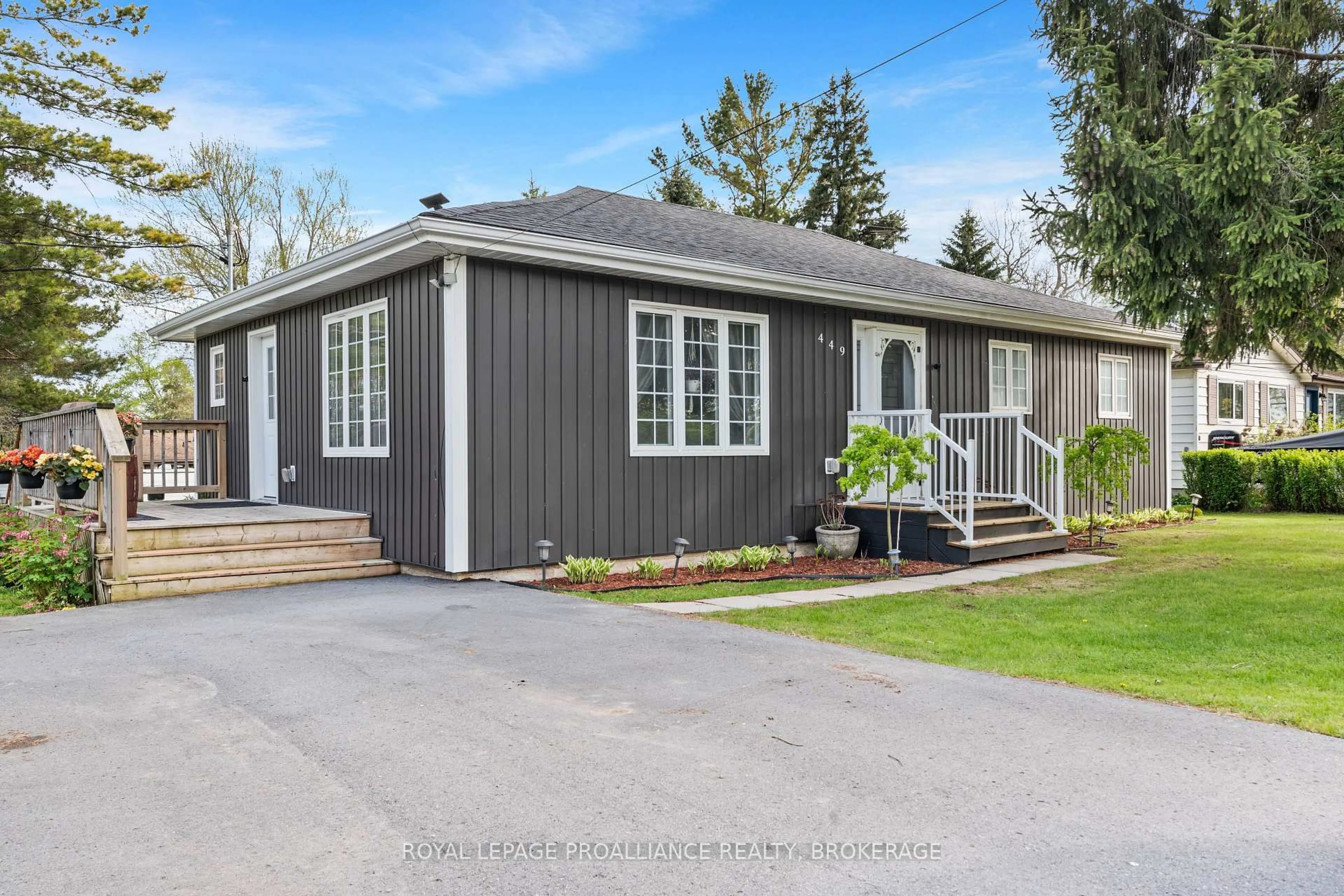 Home with vinyl exterior material, street for 449 Main St, Bath Ontario K0H 1G0