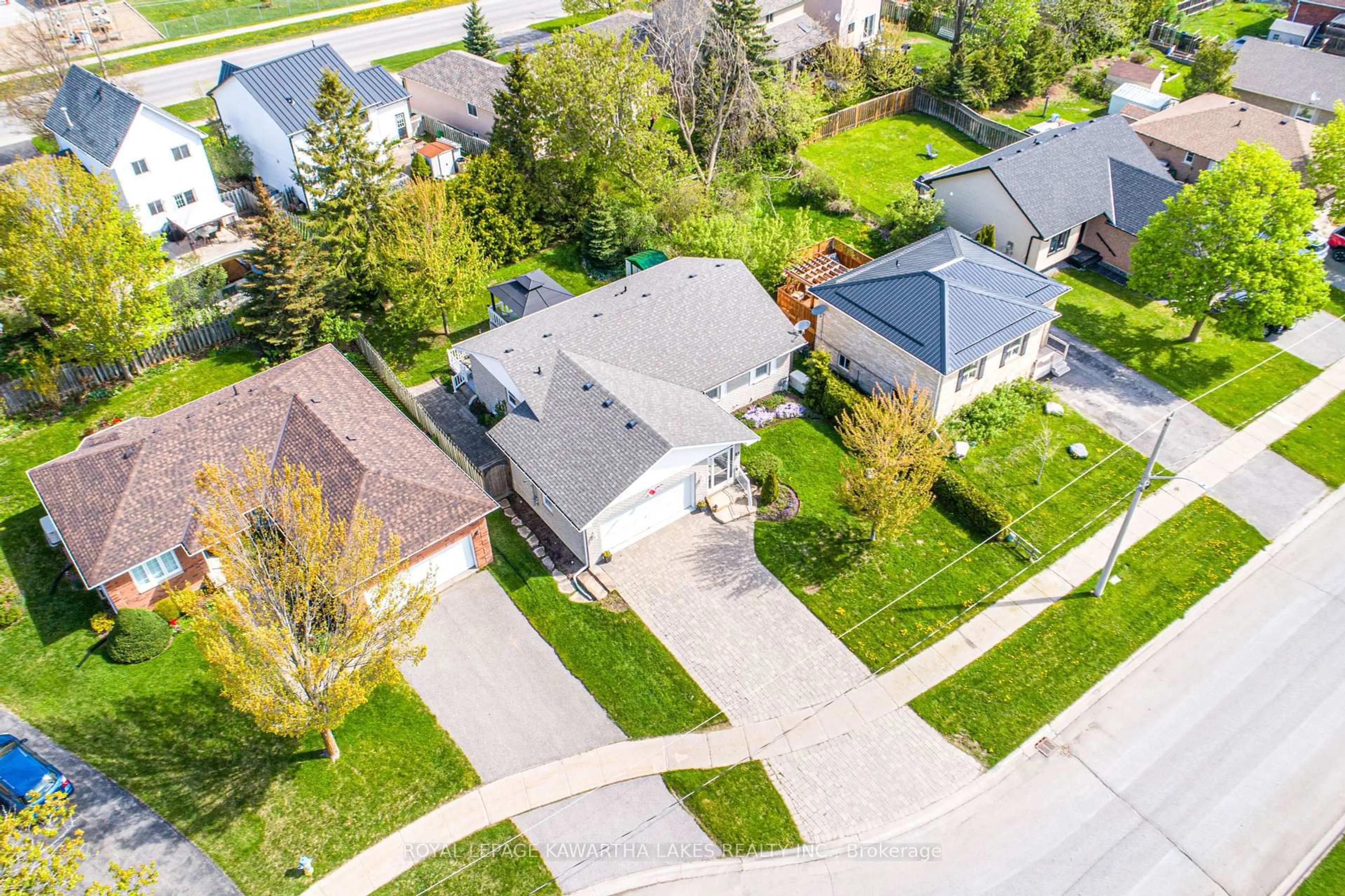 A pic from outside/outdoor area/front of a property/back of a property/a pic from drone, street for 83 Lori Blvd, Kawartha Lakes Ontario K9V 6V7