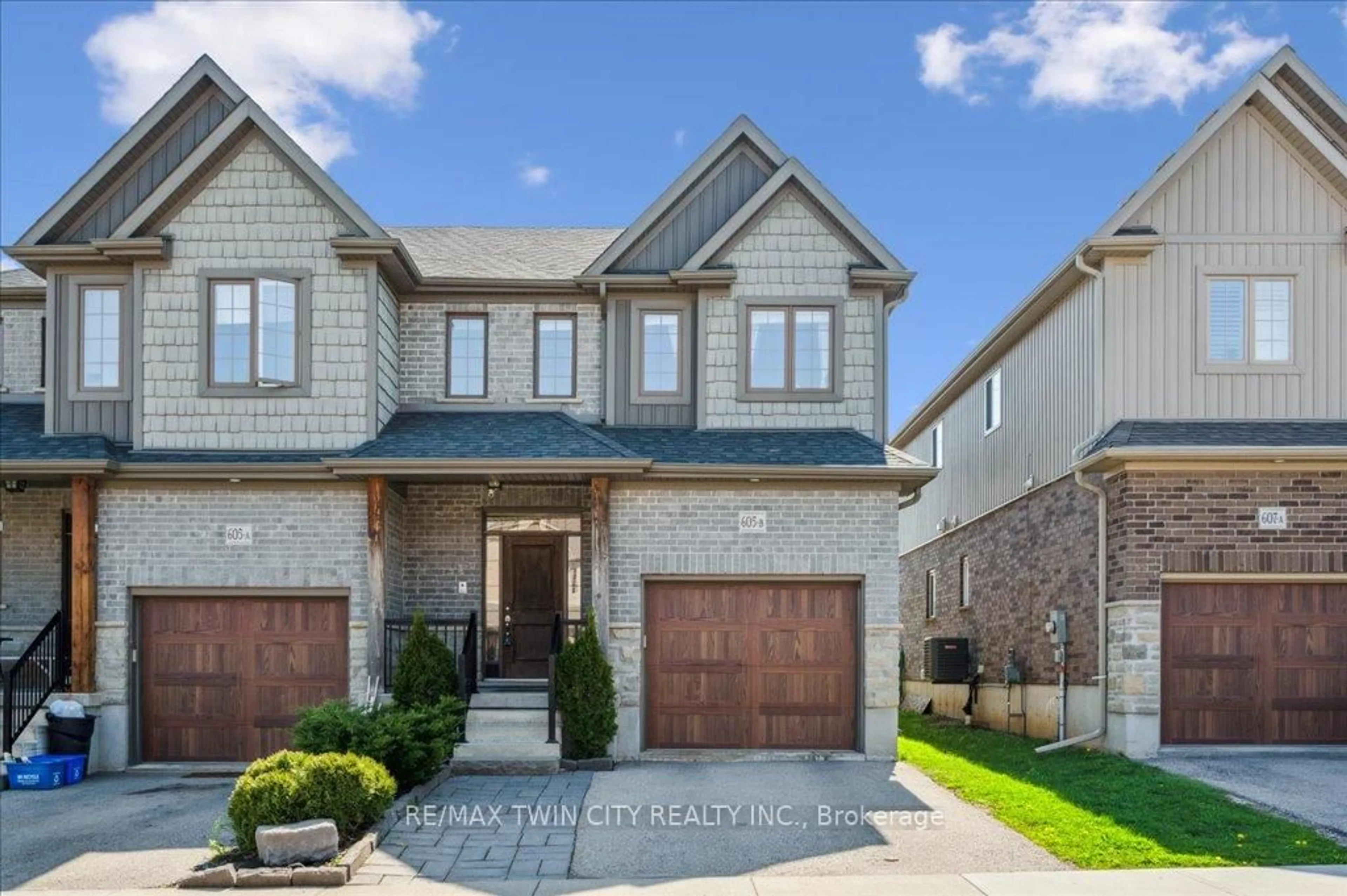 Home with brick exterior material, street for 605 Montpellier Dr #B, Waterloo Ontario N2T 2Z4