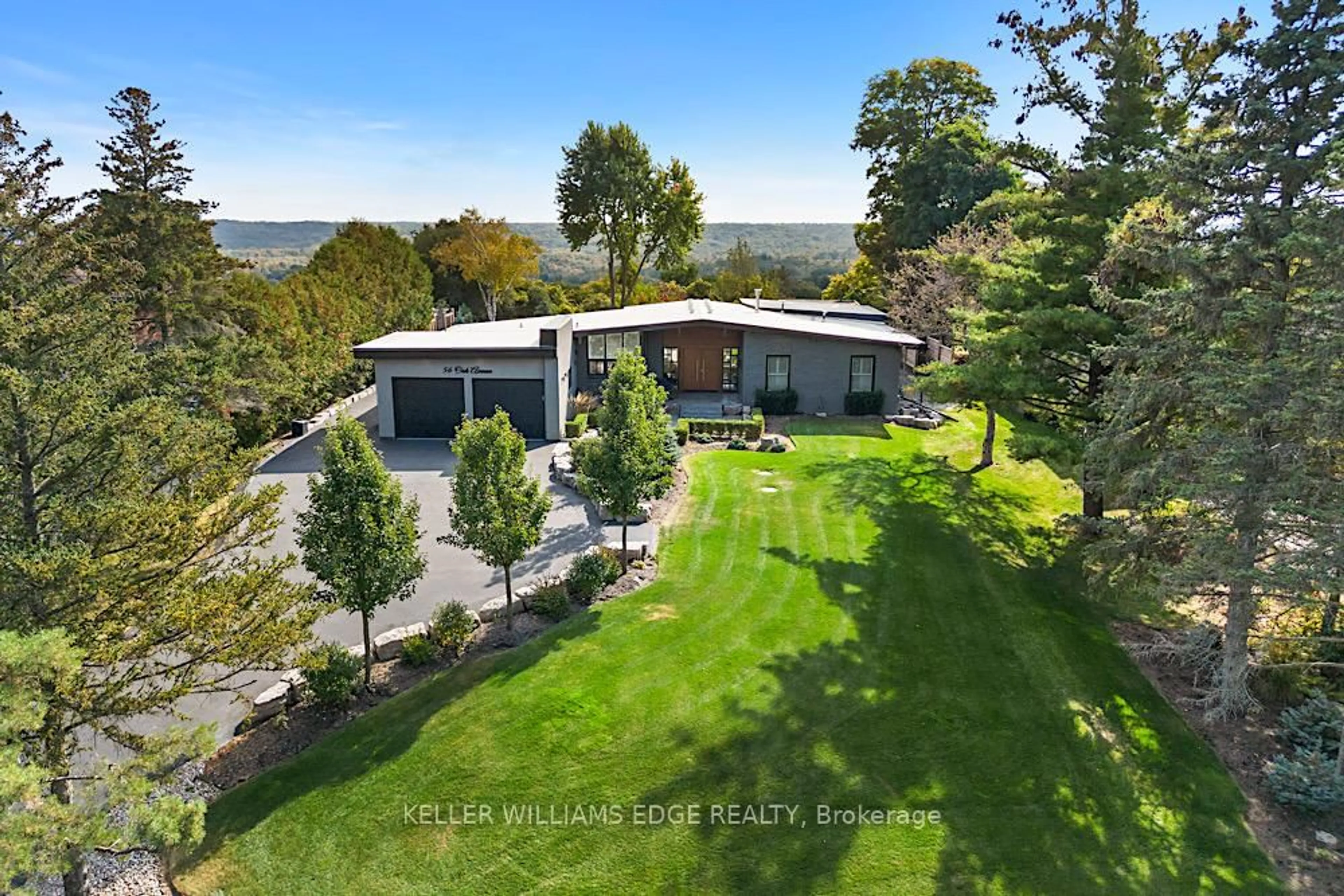 A pic from outside/outdoor area/front of a property/back of a property/a pic from drone, water/lake/river/ocean view for 56 Oak Ave, Hamilton Ontario L9H 4Y9