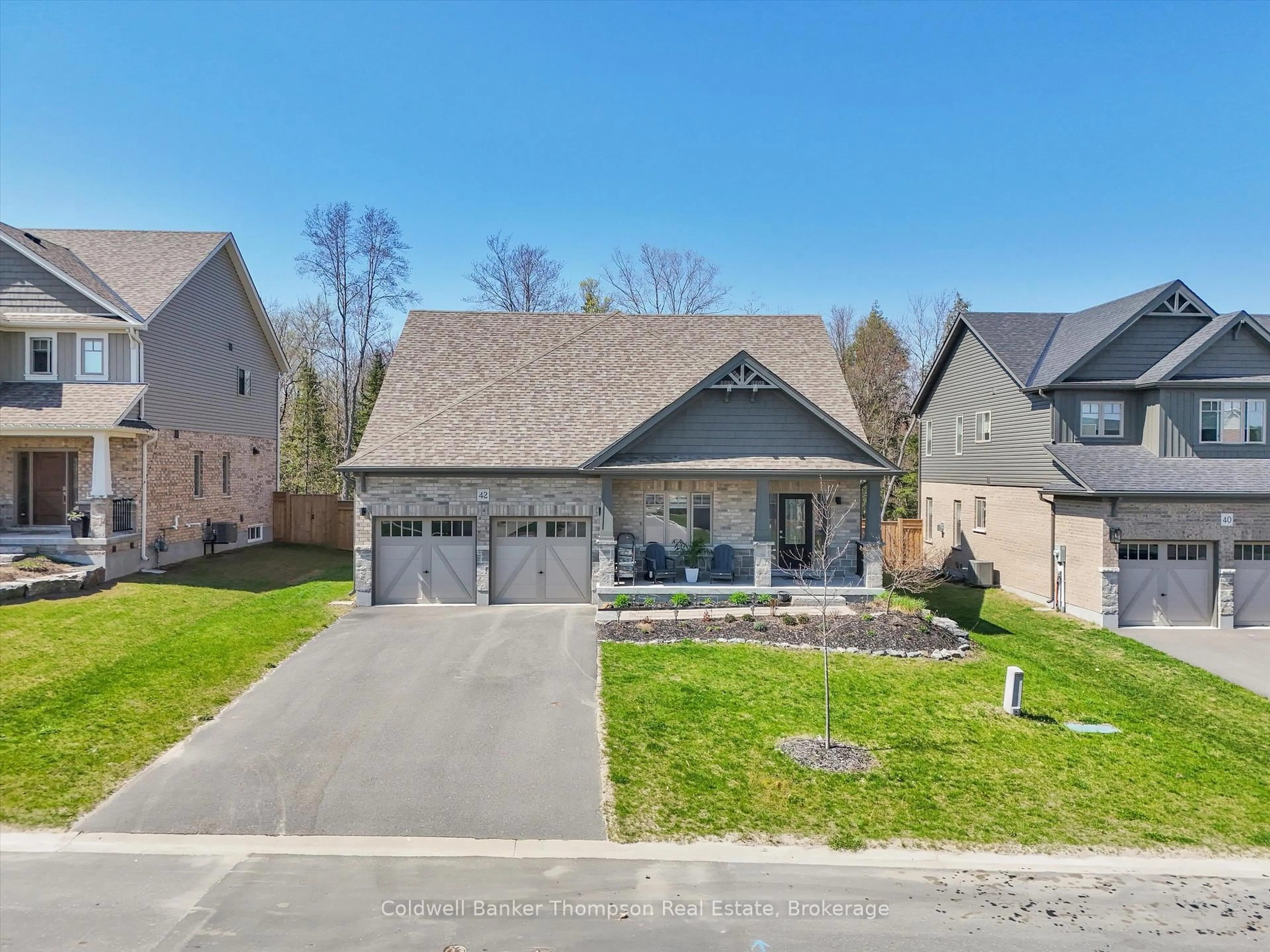 A pic from outside/outdoor area/front of a property/back of a property/a pic from drone, street for 42 Woodstream Dr, Huntsville Ontario P1H 0B7
