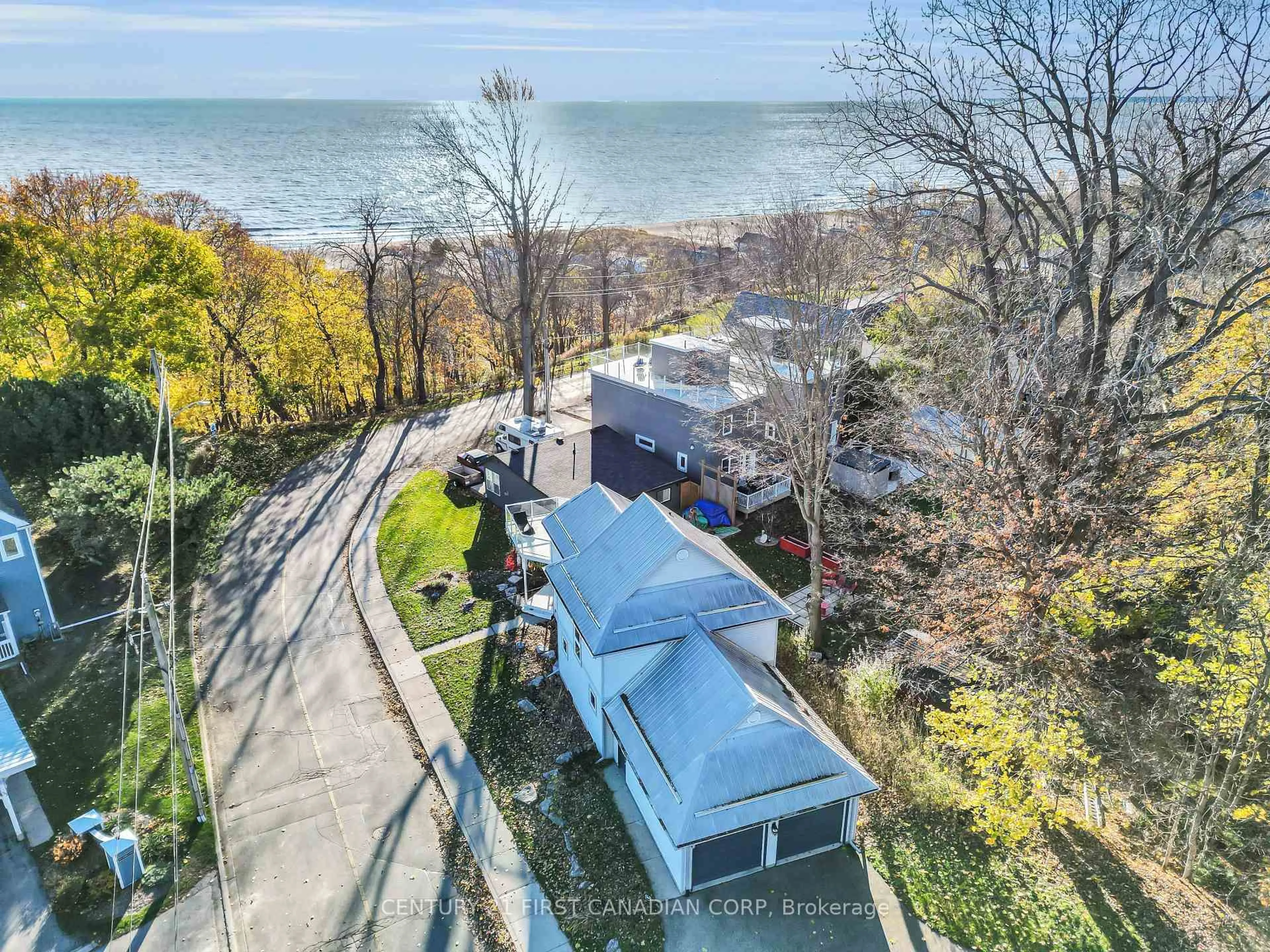 A pic from outside/outdoor area/front of a property/back of a property/a pic from drone, water/lake/river/ocean view for 379 Front St, Central Elgin Ontario N5L 1G2