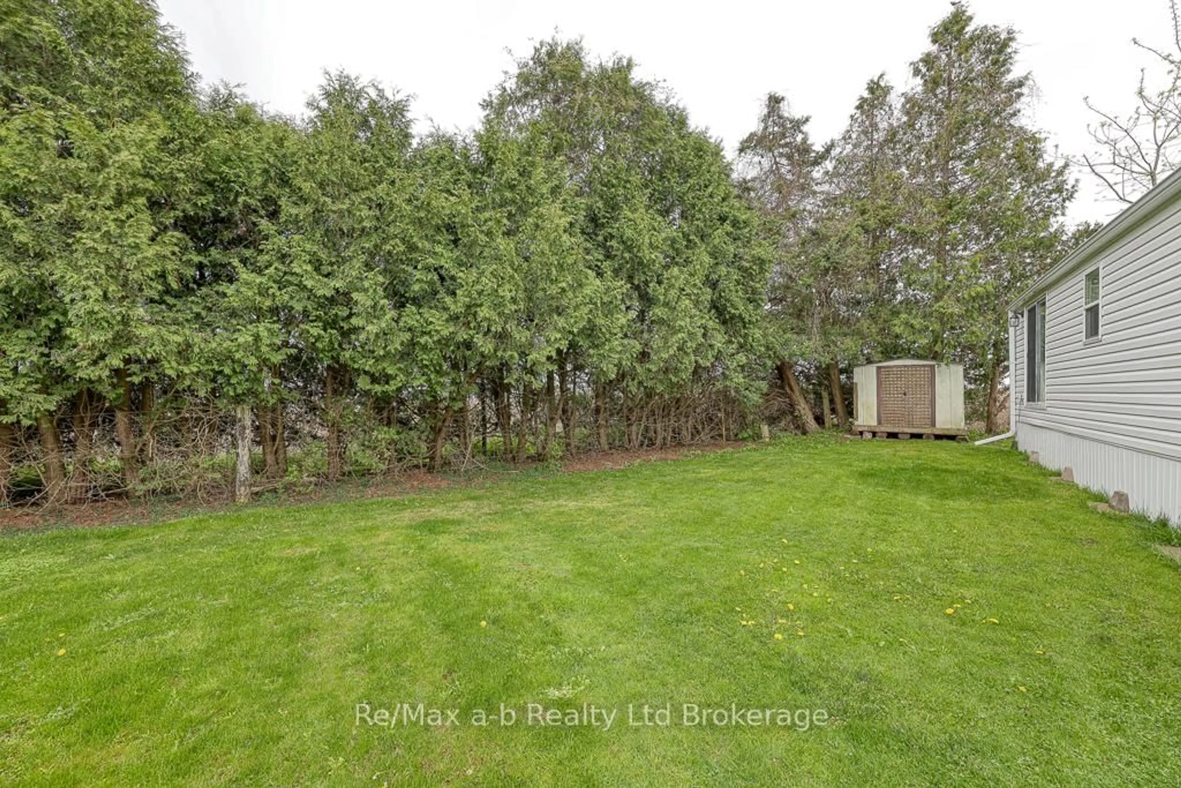 A pic from outside/outdoor area/front of a property/back of a property/a pic from drone, forest/trees view for 595487 OXFORD 59 Rd #20, East Zorra-Tavistock Ontario N4S 7W1