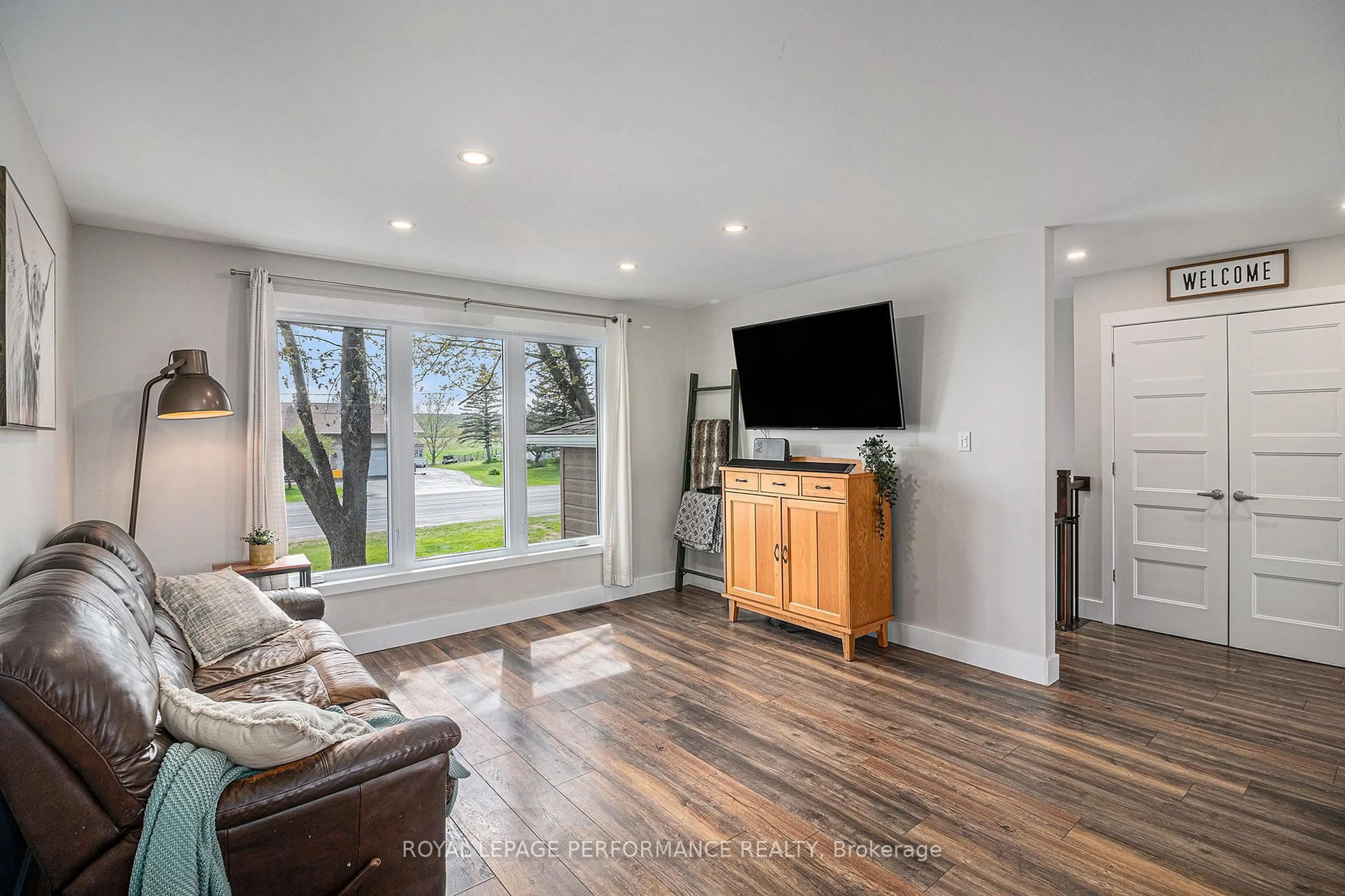 Living room with furniture, wood/laminate floor for 570 county road 9 Rd, Alfred and Plantagenet Ontario K0B 1L0