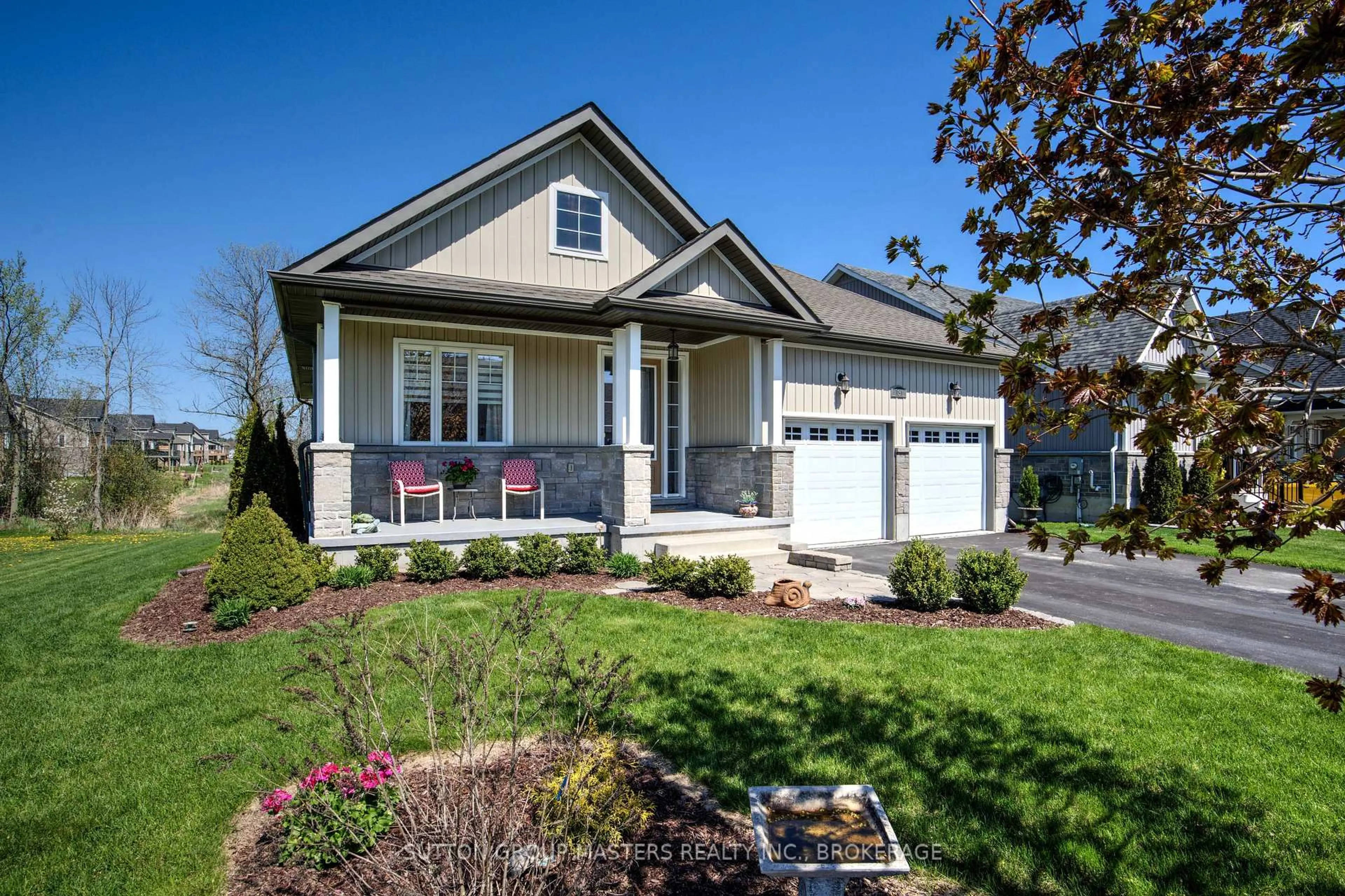 Home with vinyl exterior material, street for 131 Country Club Dr, Bath Ontario K0H 1G0