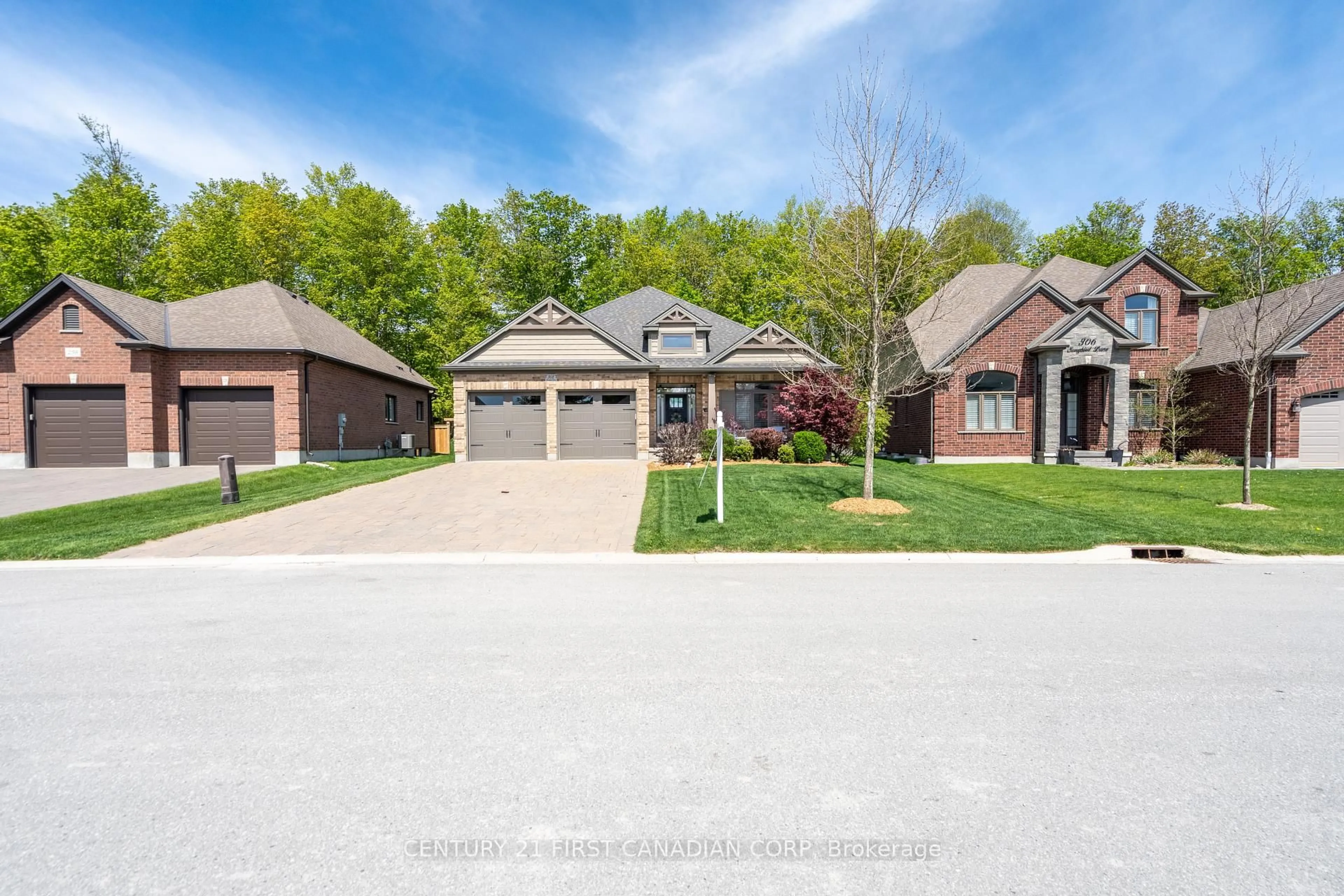 Home with brick exterior material, street for 302 Songbird Lane, Middlesex Centre Ontario N0M 2A0