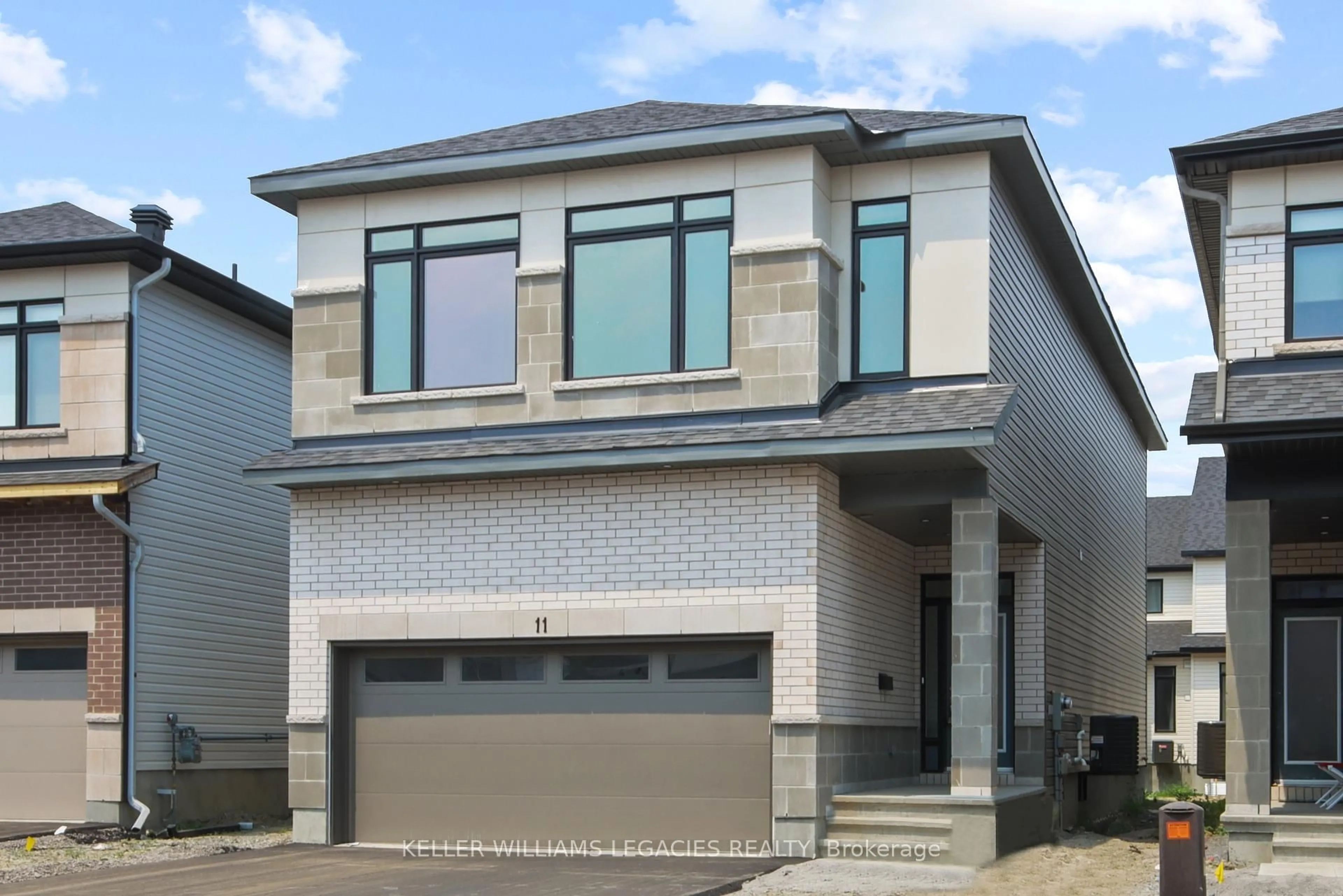 Home with brick exterior material, street for 11 Mendoza Way, Ottawa Ontario K2S 1B6