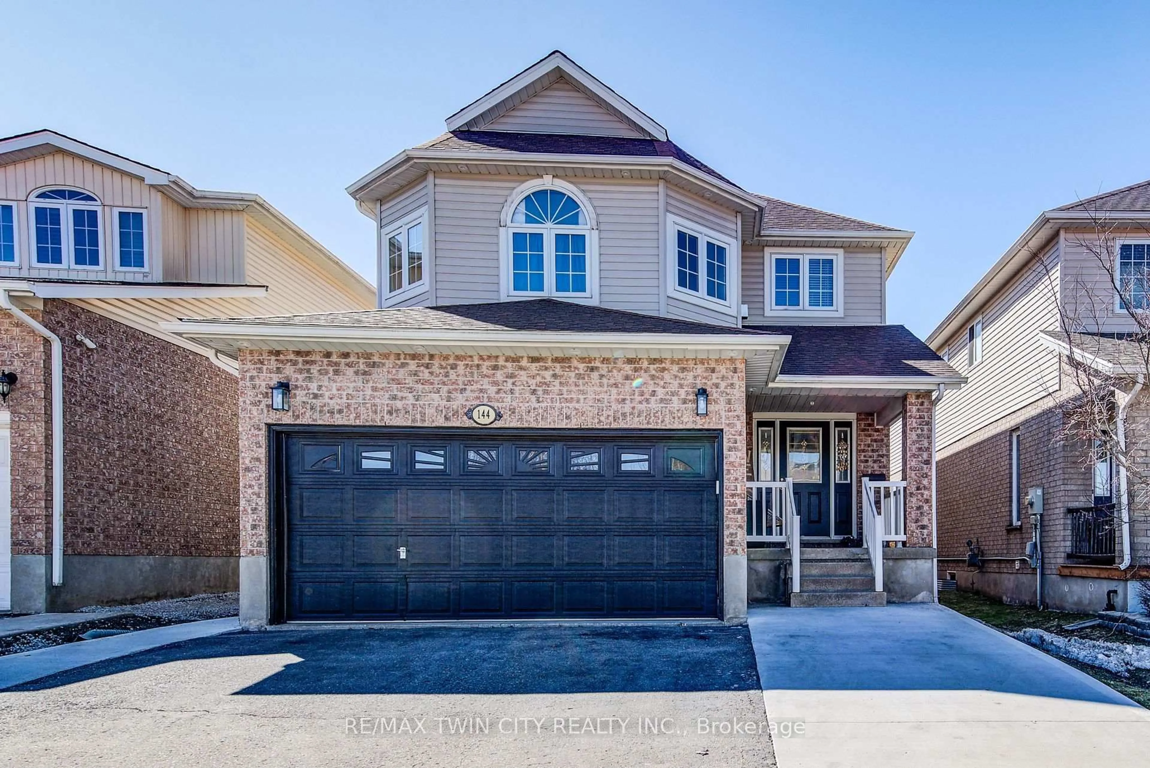 Home with brick exterior material, street for 144 Udvari Cres, Kitchener Ontario N2N 3P6