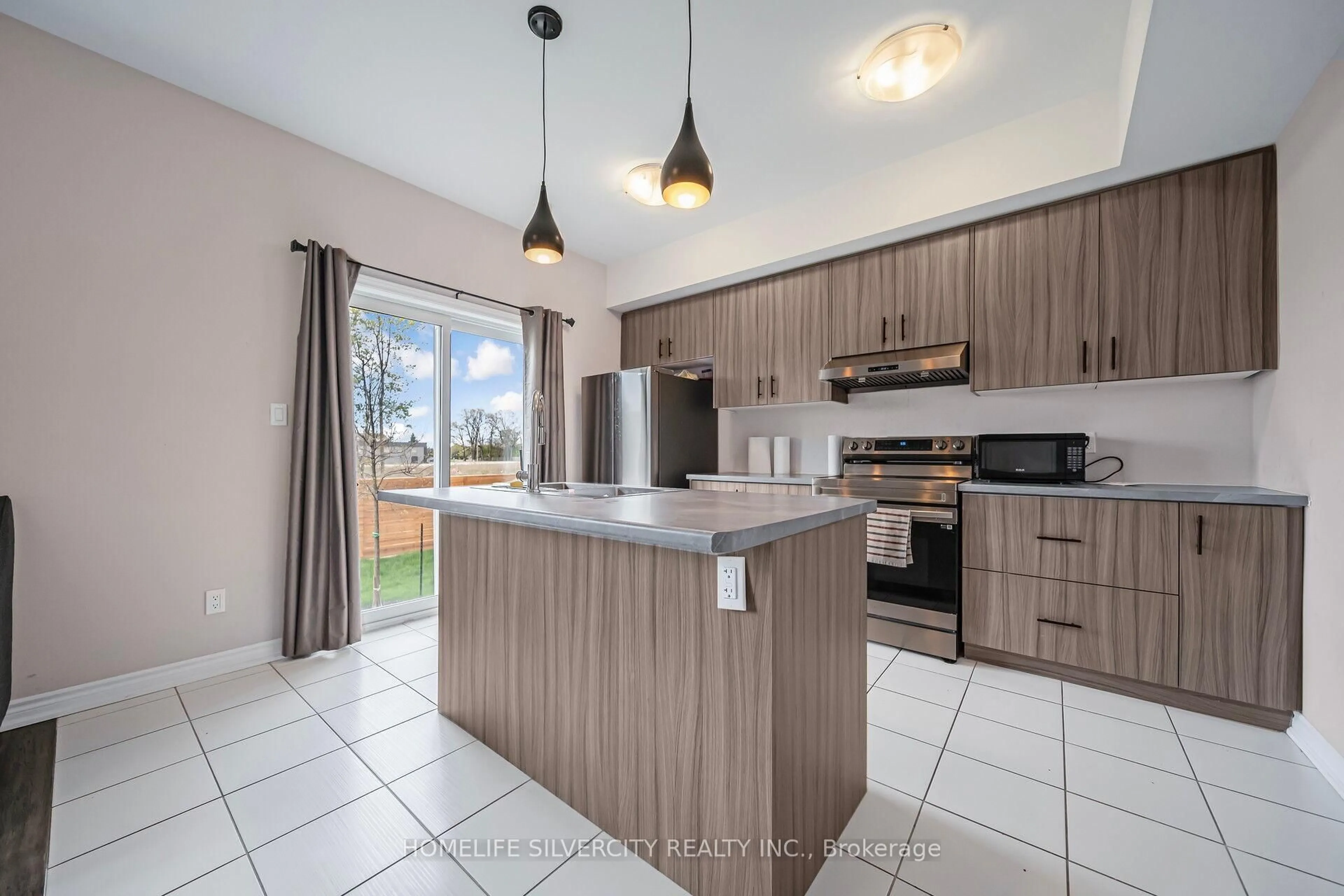 Open concept kitchen, ceramic/tile floor for 5672 Dorchester Rd #4, Niagara Falls Ontario L2G 4Y8