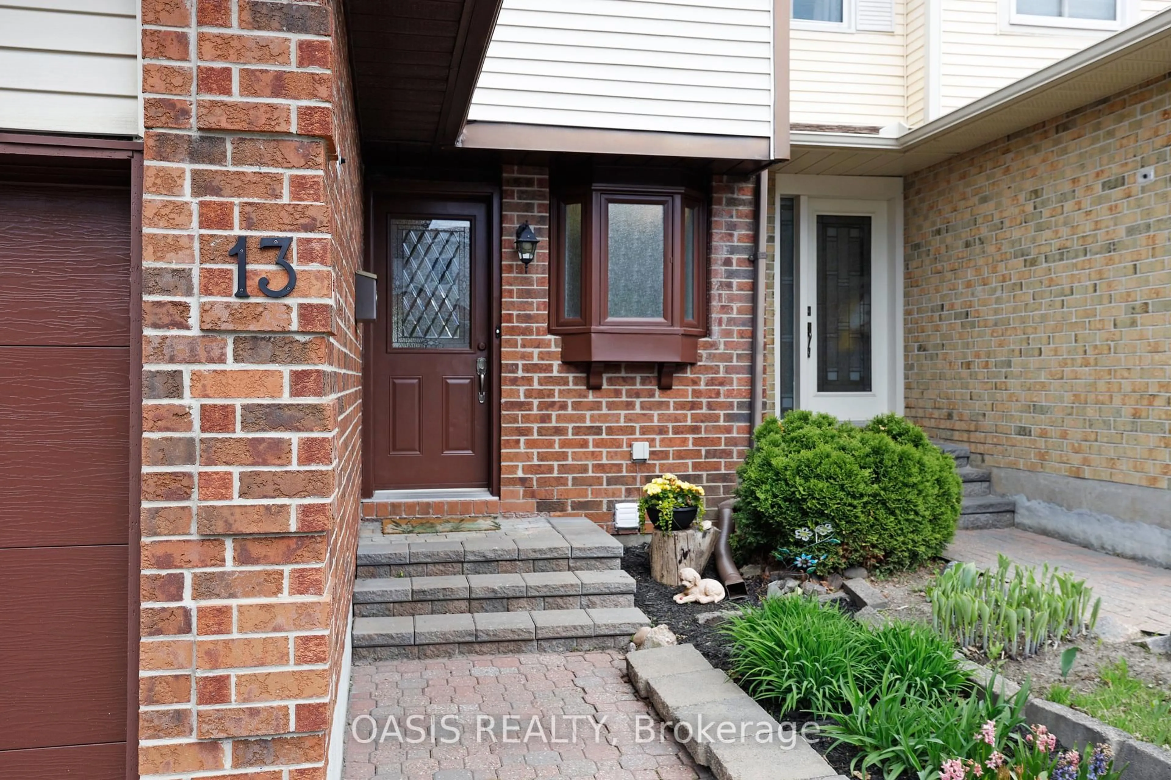Home with brick exterior material, street for 13 Sundback Lane, Ottawa Ontario K2L 2W9