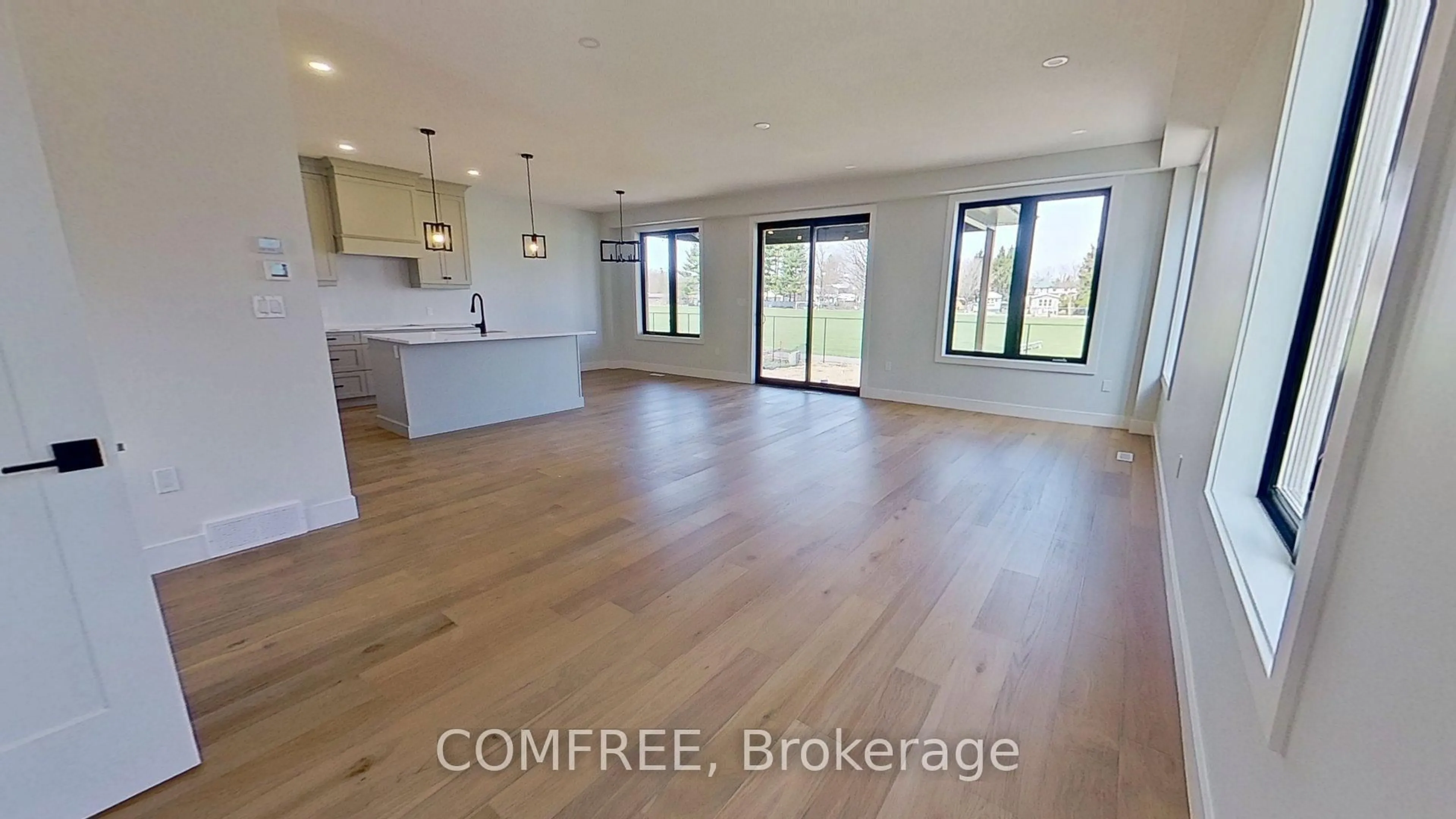 Open concept kitchen, wood/laminate floor for 179 Foxborough Pl, Thames Centre Ontario N0M 2P0