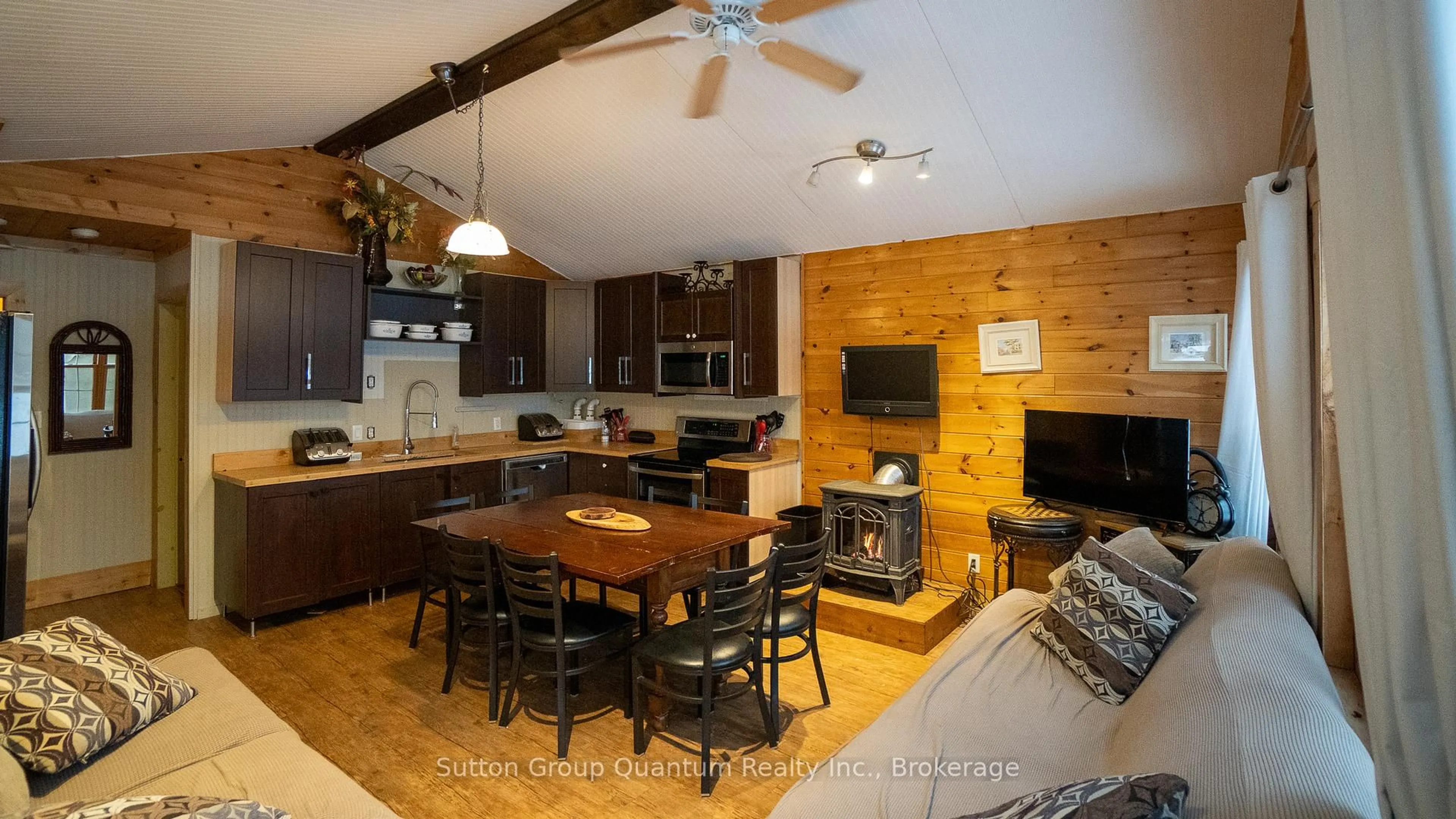 Open concept kitchen, wood/laminate floor for 3 WOODLAND Lane, Magnetawan Ontario P0A 1P0