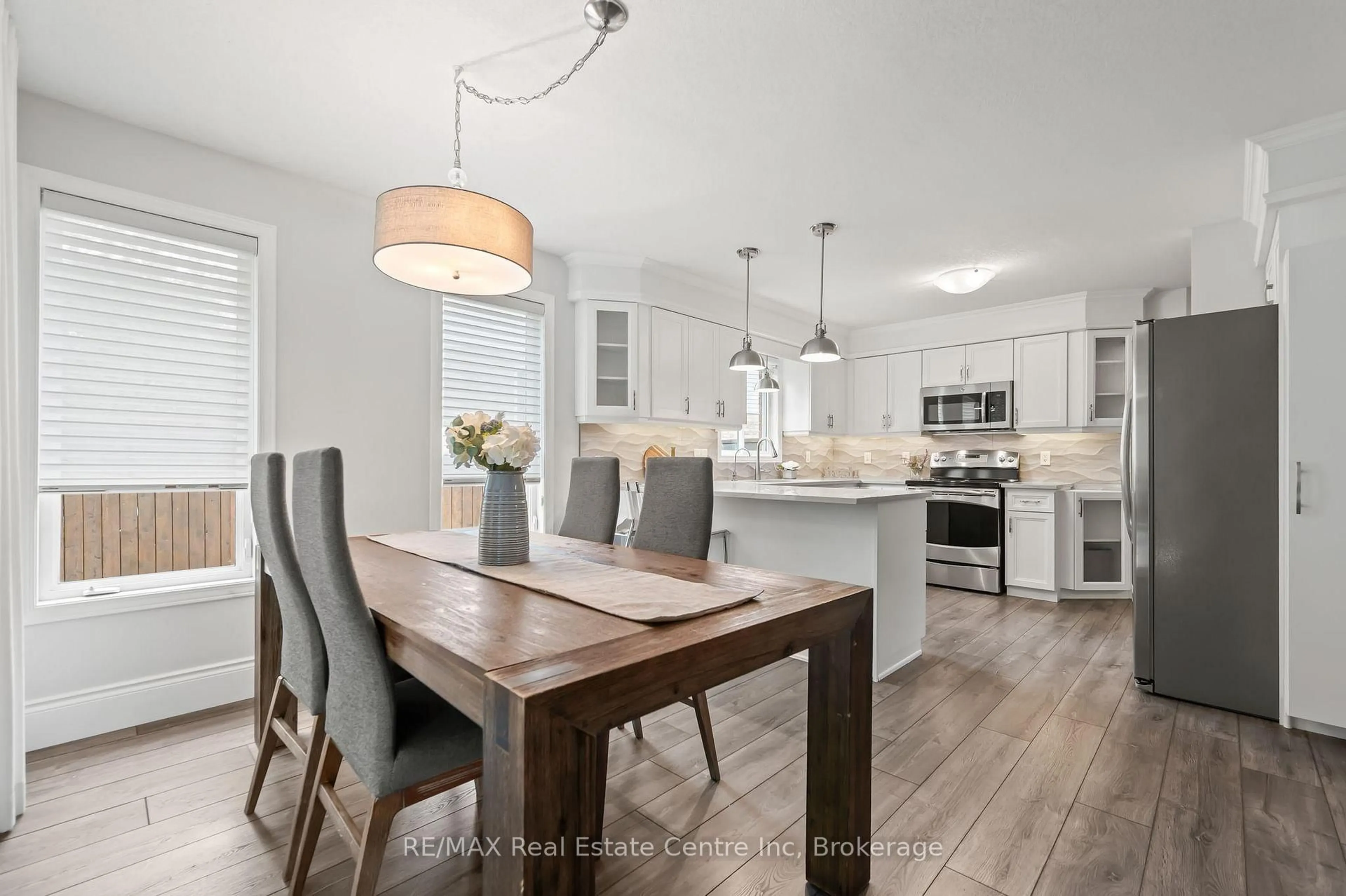 Open concept kitchen, wood/laminate floor for 52 Bond Crt, Guelph Ontario N1H 8N7
