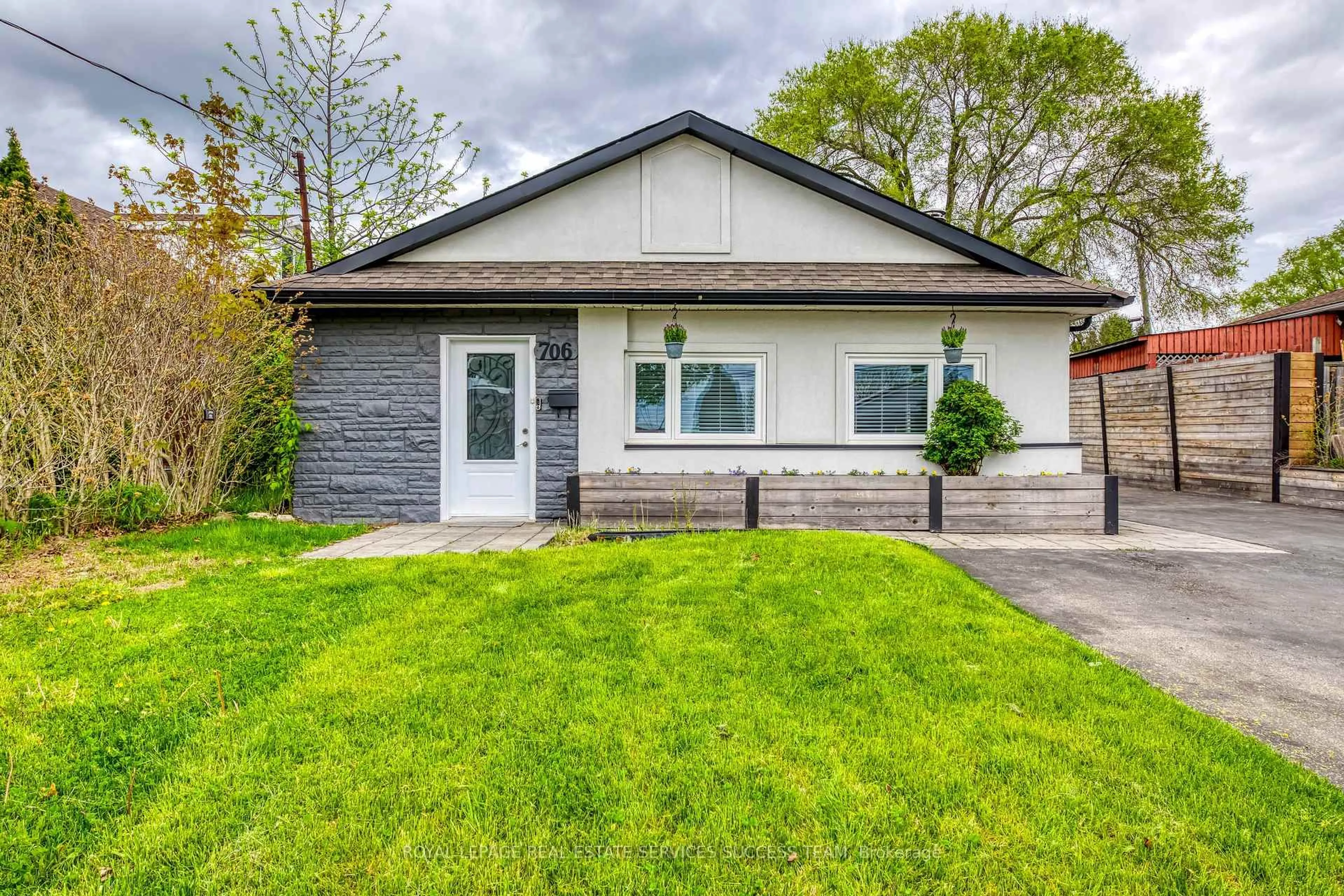 Home with vinyl exterior material, street for 706 West 5th St, Hamilton Ontario L9C 3R2