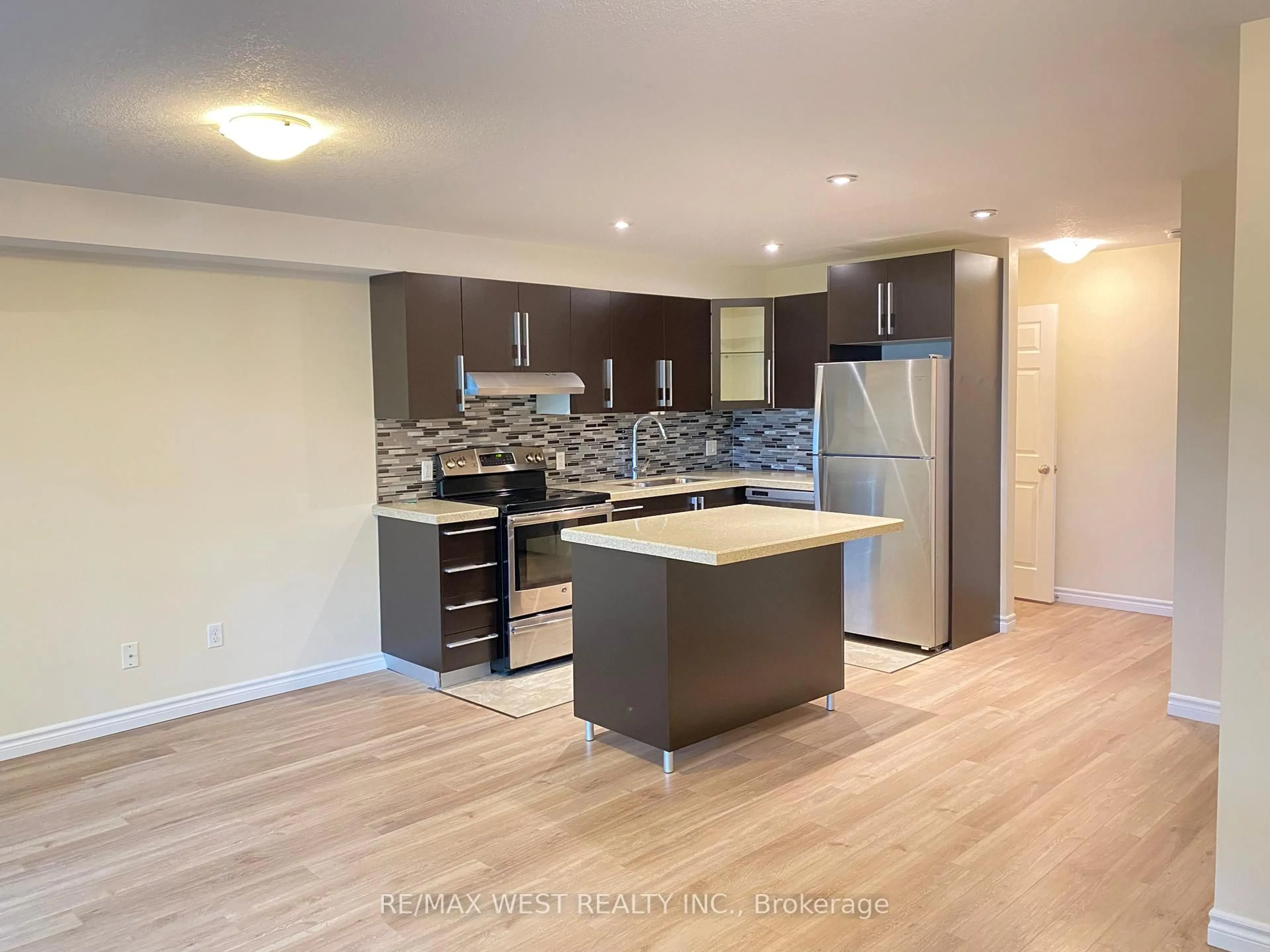 Open concept kitchen, wood/laminate floor for 93 Gage Ave #1, Kitchener Ontario N2G 0A8