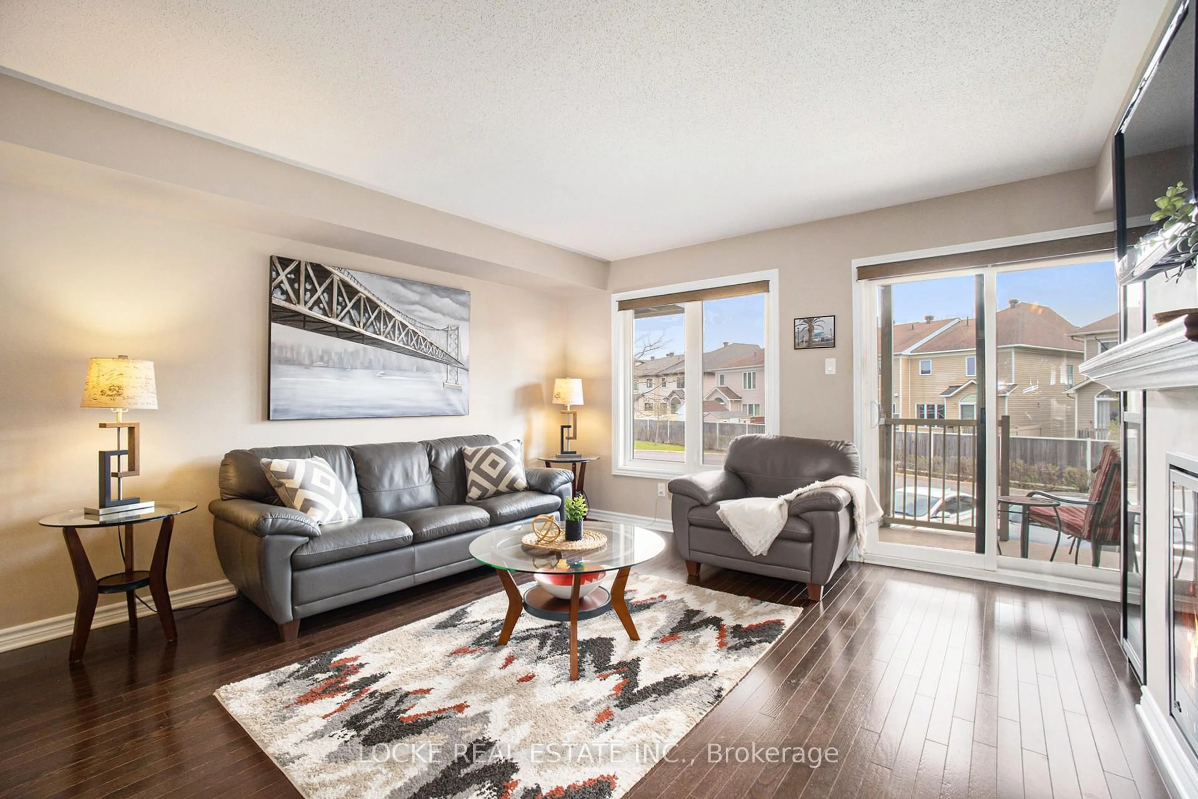 Living room with furniture, wood/laminate floor for 2411 Esprit Dr, Ottawa Ontario K4A 0T4