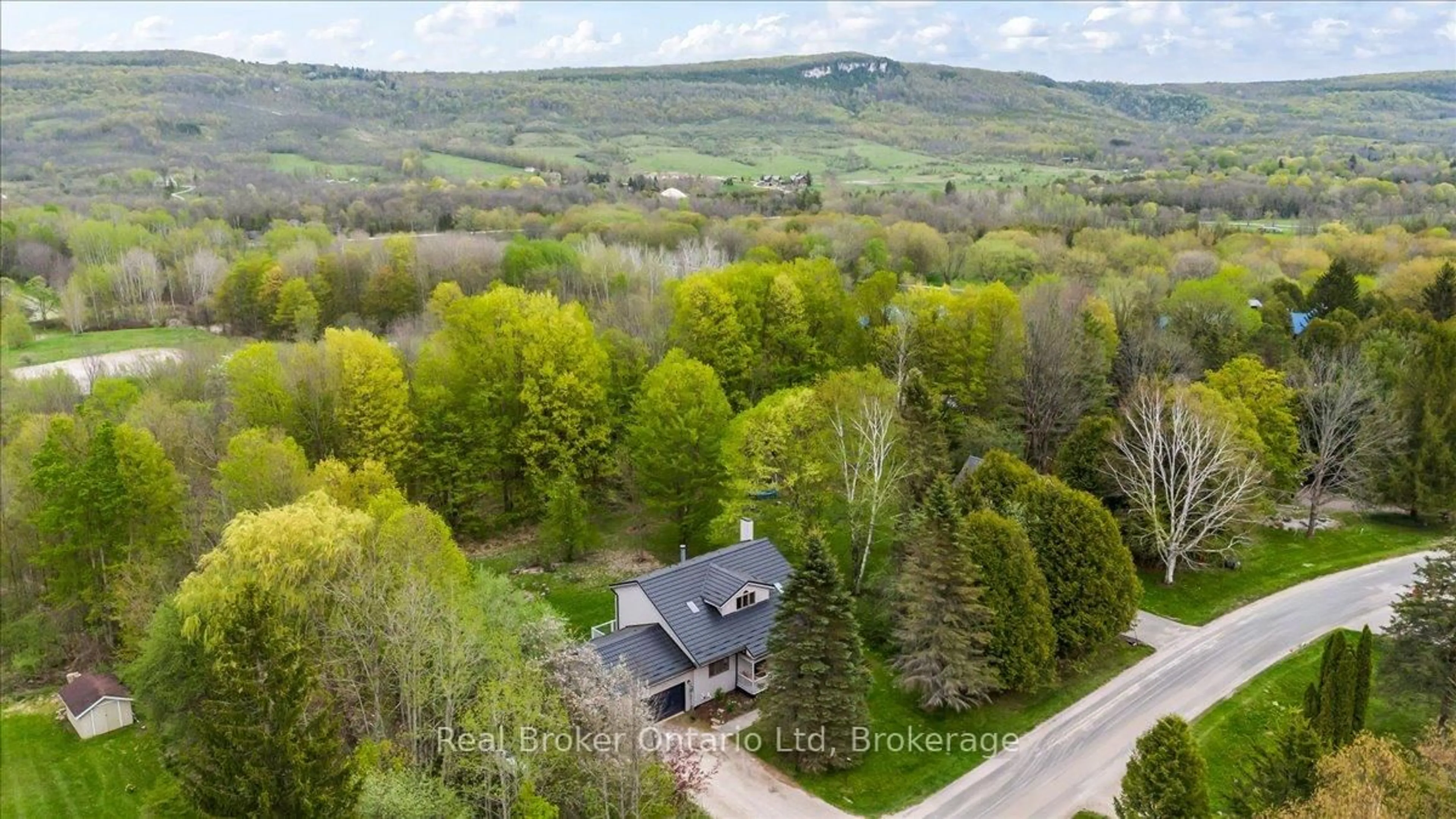 A pic from outside/outdoor area/front of a property/back of a property/a pic from drone, forest/trees view for 109 Wodehouse Crt, Grey Highlands Ontario N0C 1G0