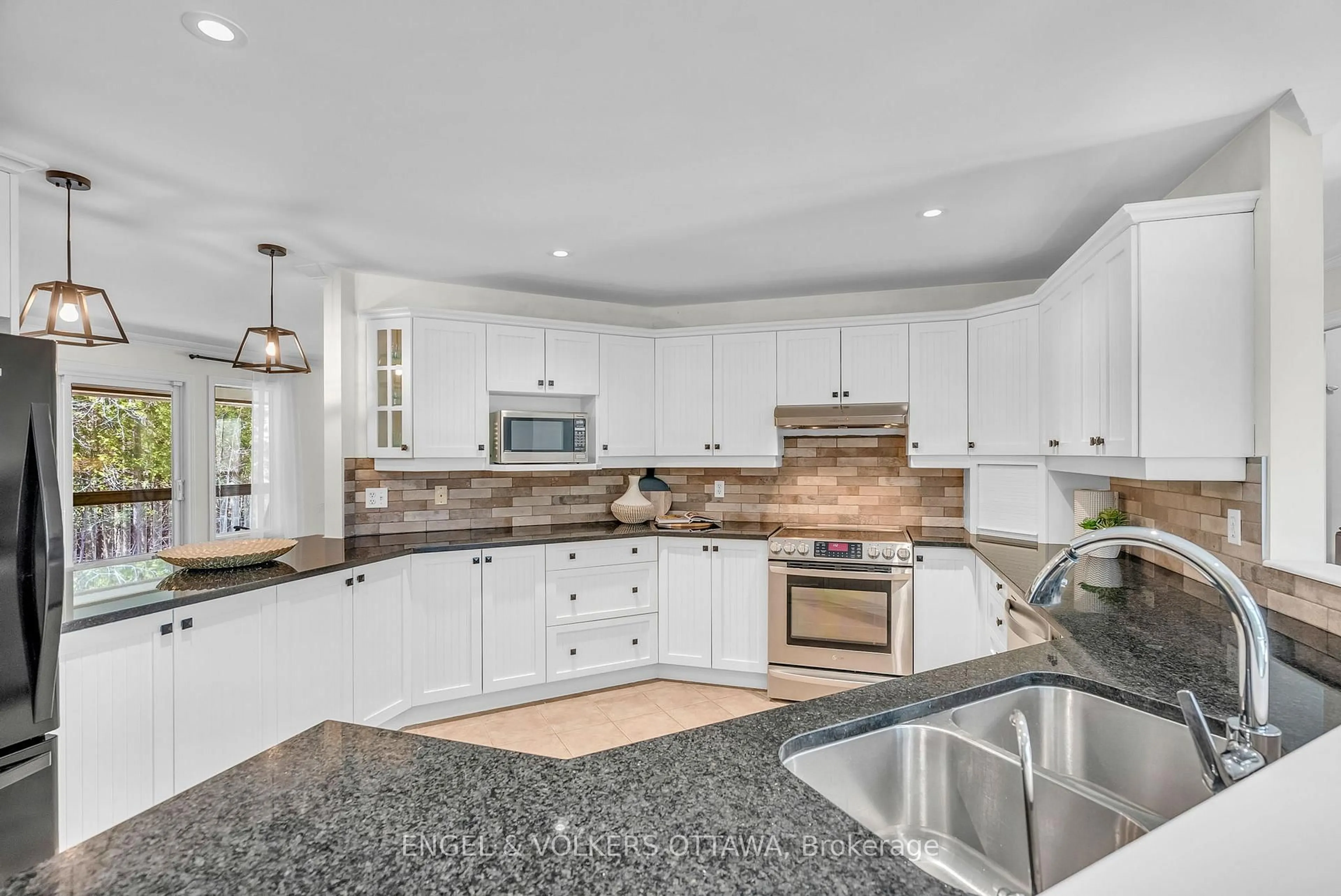 Open concept kitchen, ceramic/tile floor for 7359 Marcella Dr, Ottawa Ontario K4P 1P7