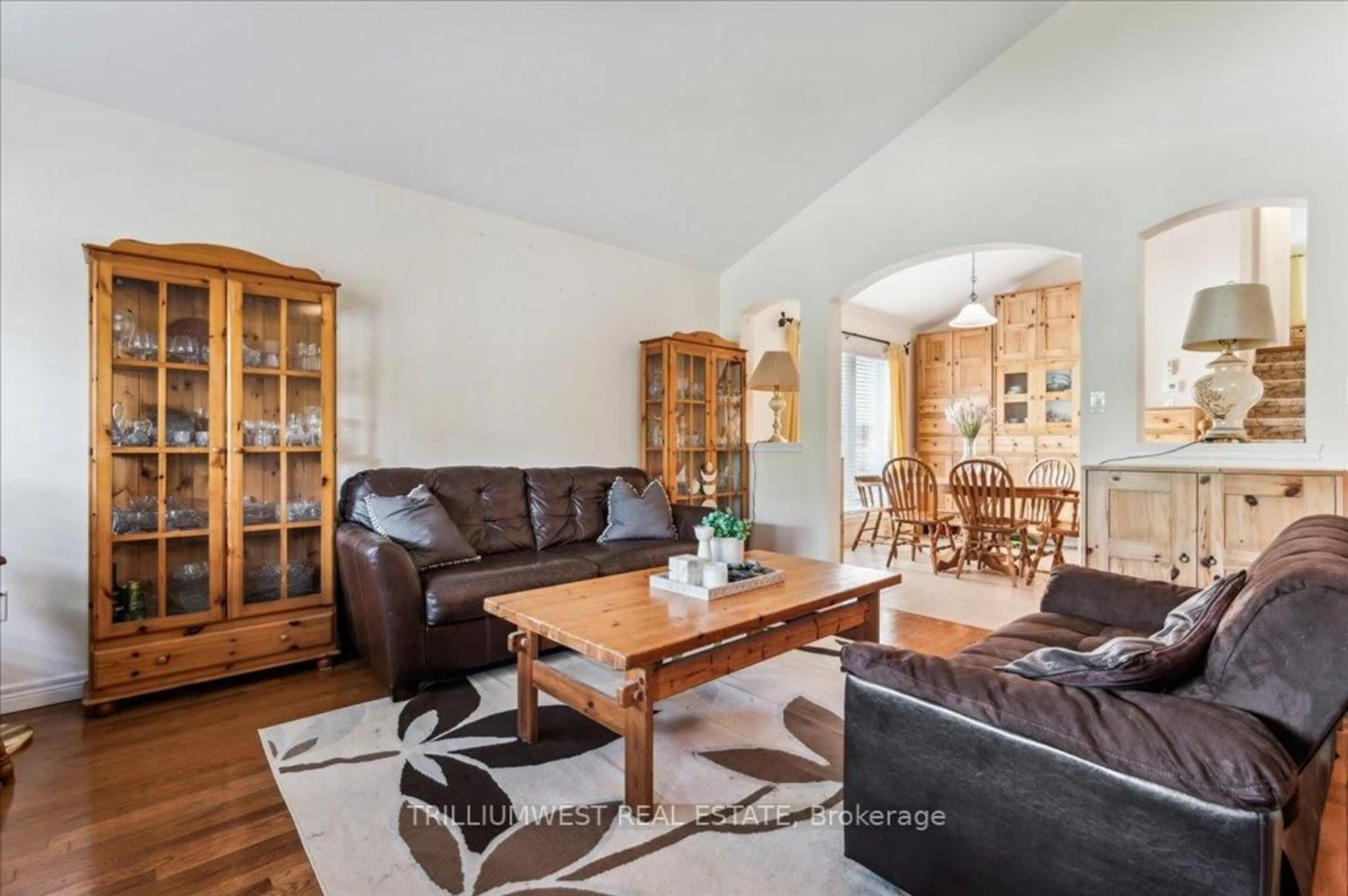 Living room with furniture, wood/laminate floor for 19 Housler Lane, Cambridge Ontario N3C 4H7