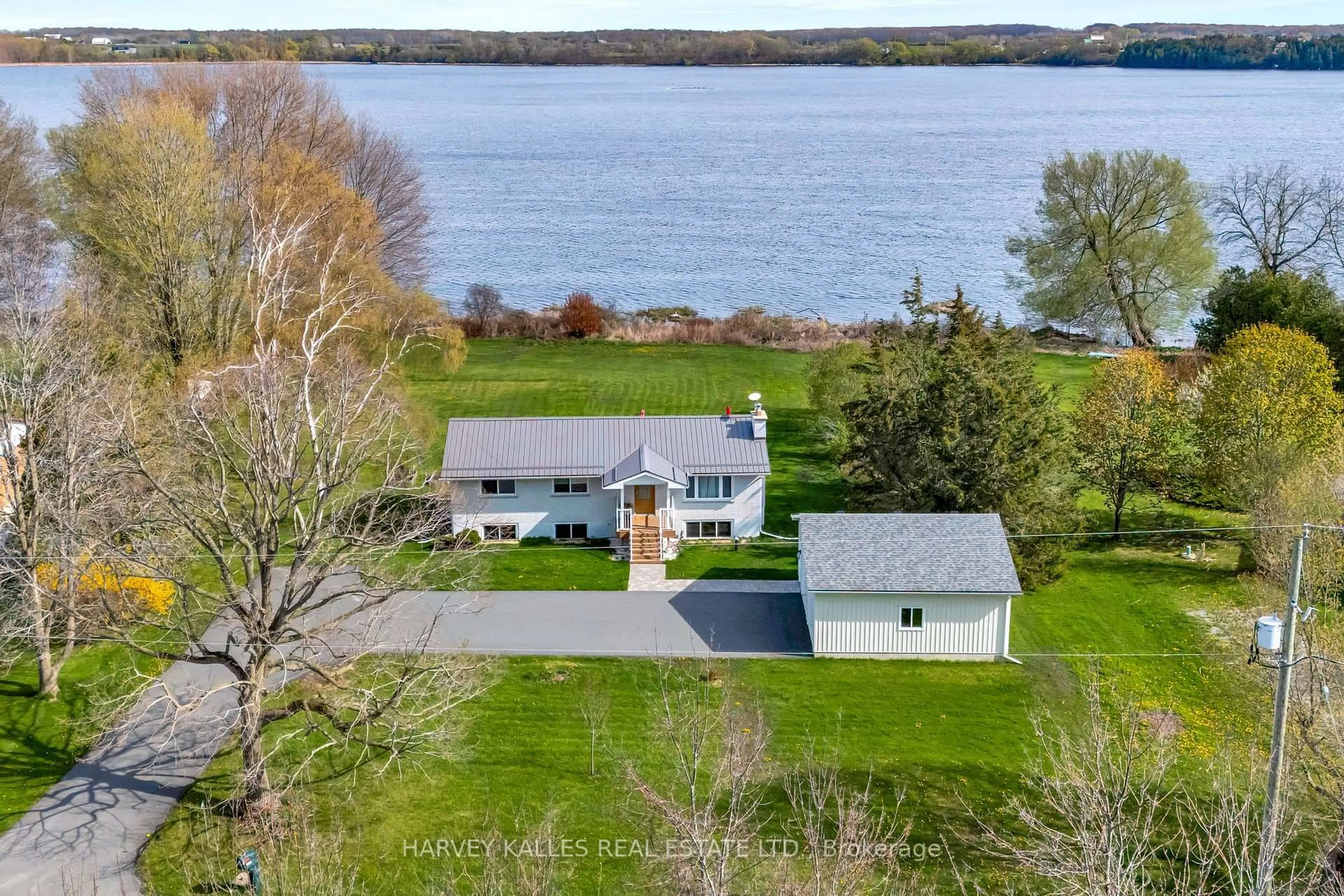 A pic from outside/outdoor area/front of a property/back of a property/a pic from drone, water/lake/river/ocean view for 1583 Lakeside Dr, Prince Edward County Ontario K0K 1T0