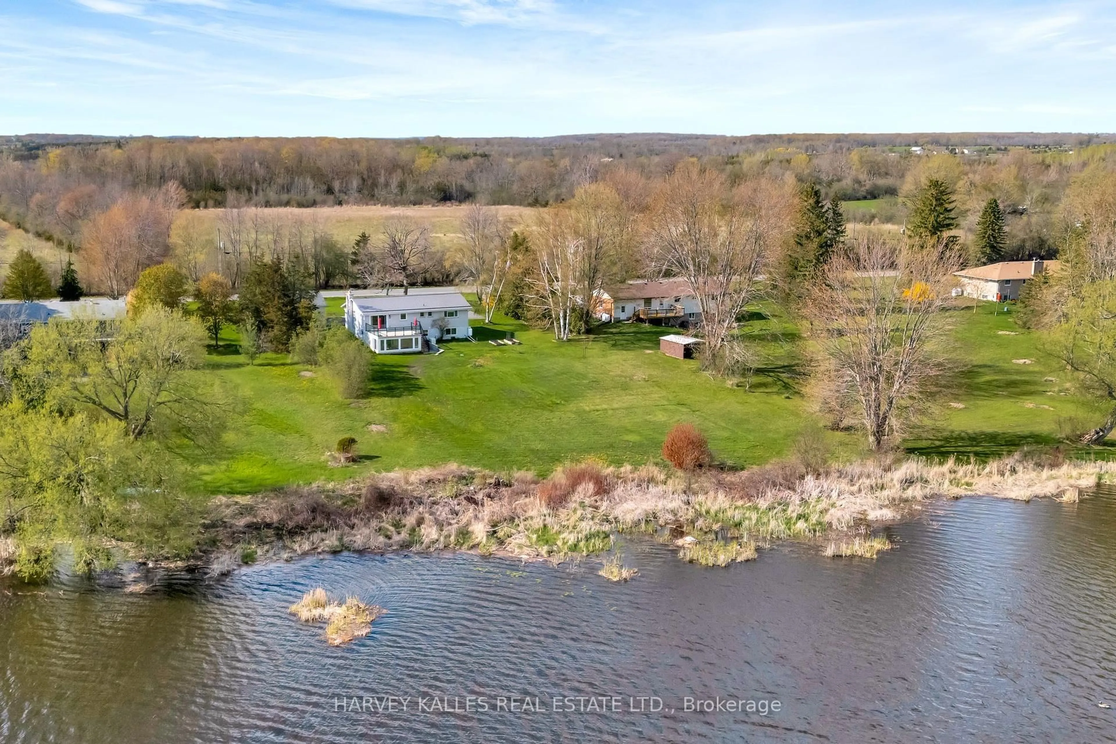 A pic from outside/outdoor area/front of a property/back of a property/a pic from drone, water/lake/river/ocean view for 1583 Lakeside Dr, Prince Edward County Ontario K0K 1T0