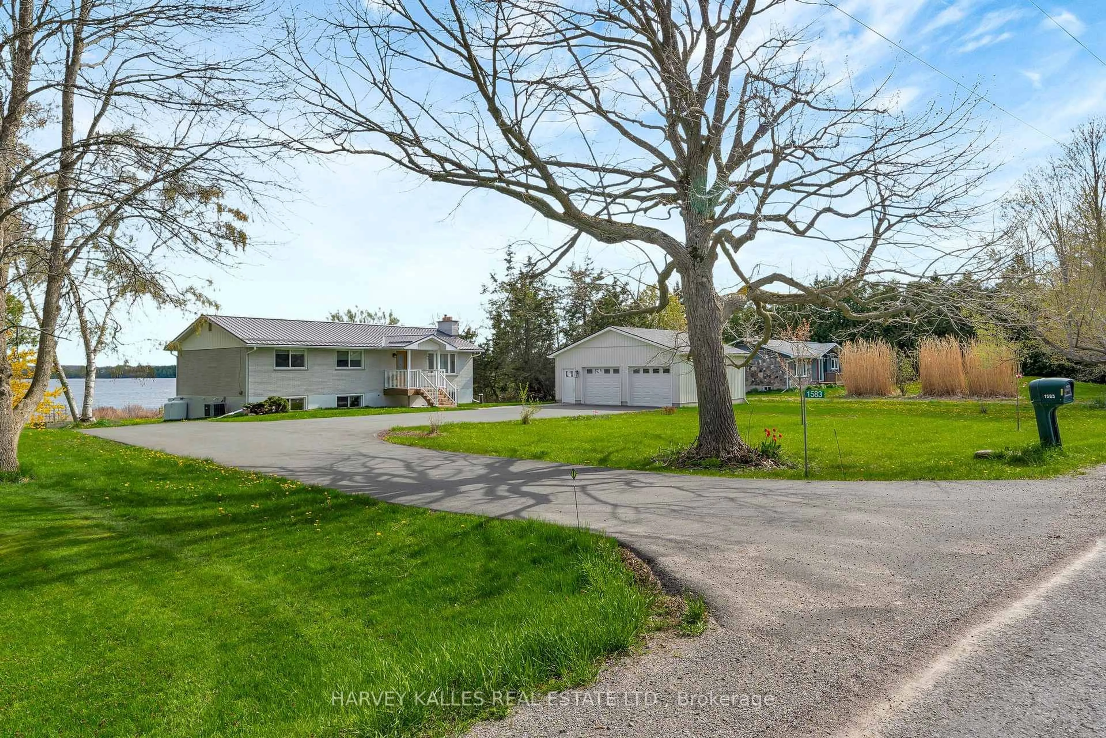 A pic from outside/outdoor area/front of a property/back of a property/a pic from drone, street for 1583 Lakeside Dr, Prince Edward County Ontario K0K 1T0