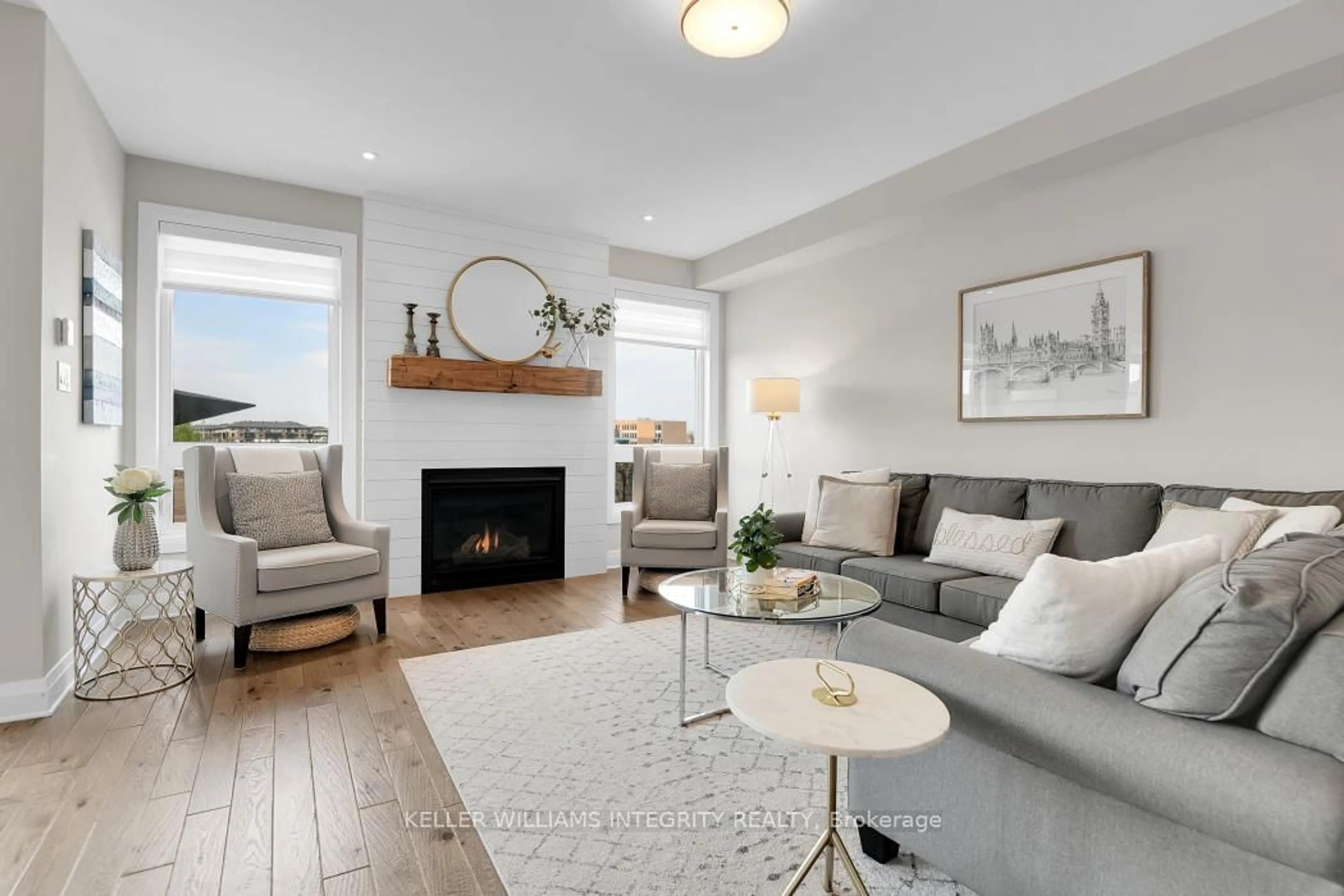 Living room with furniture, wood/laminate floor for 828 Carnelian Cres, Ottawa Ontario K1X 0A7