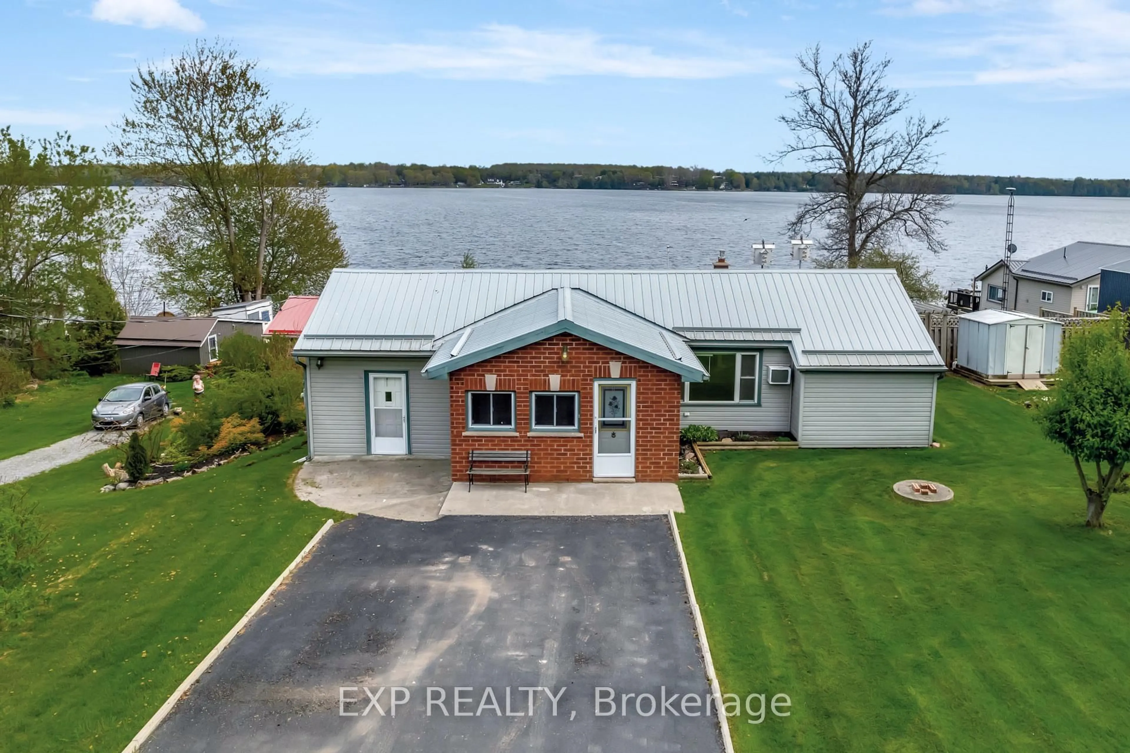 A pic from outside/outdoor area/front of a property/back of a property/a pic from drone, water/lake/river/ocean view for 1083 Lakeside Dr, Prince Edward County Ontario K0K 1T0