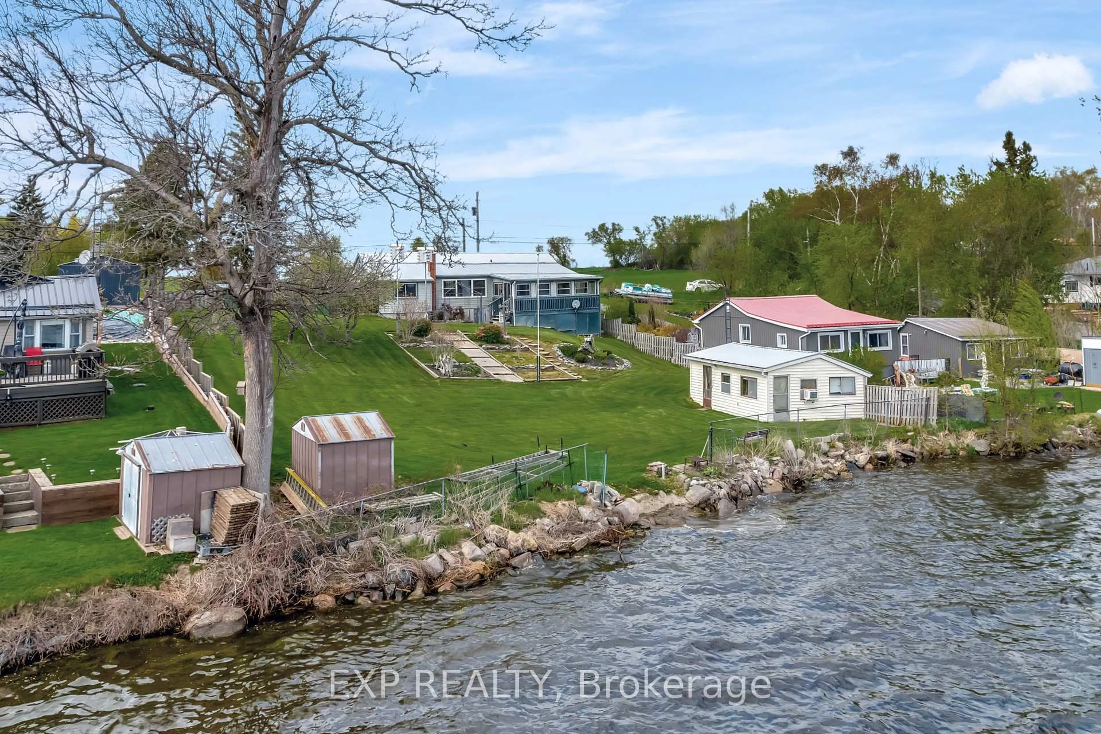 A pic from outside/outdoor area/front of a property/back of a property/a pic from drone, water/lake/river/ocean view for 1083 Lakeside Dr, Prince Edward County Ontario K0K 1T0