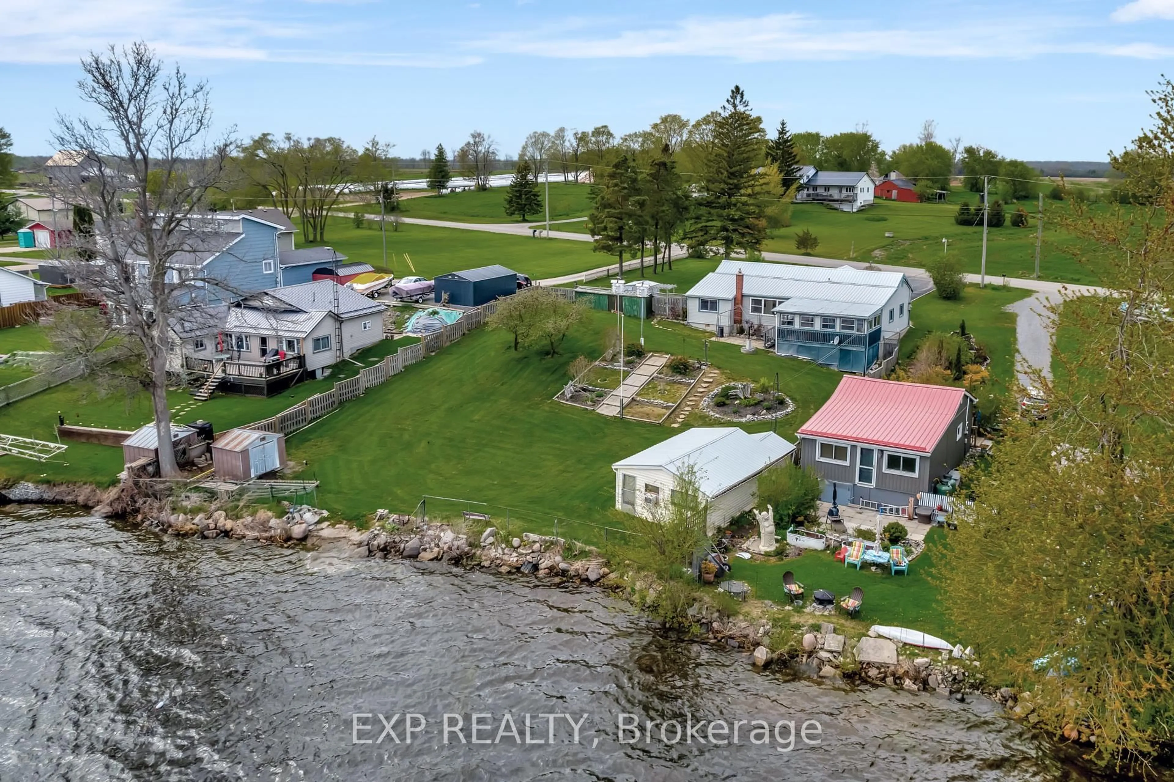 A pic from outside/outdoor area/front of a property/back of a property/a pic from drone, water/lake/river/ocean view for 1083 Lakeside Dr, Prince Edward County Ontario K0K 1T0